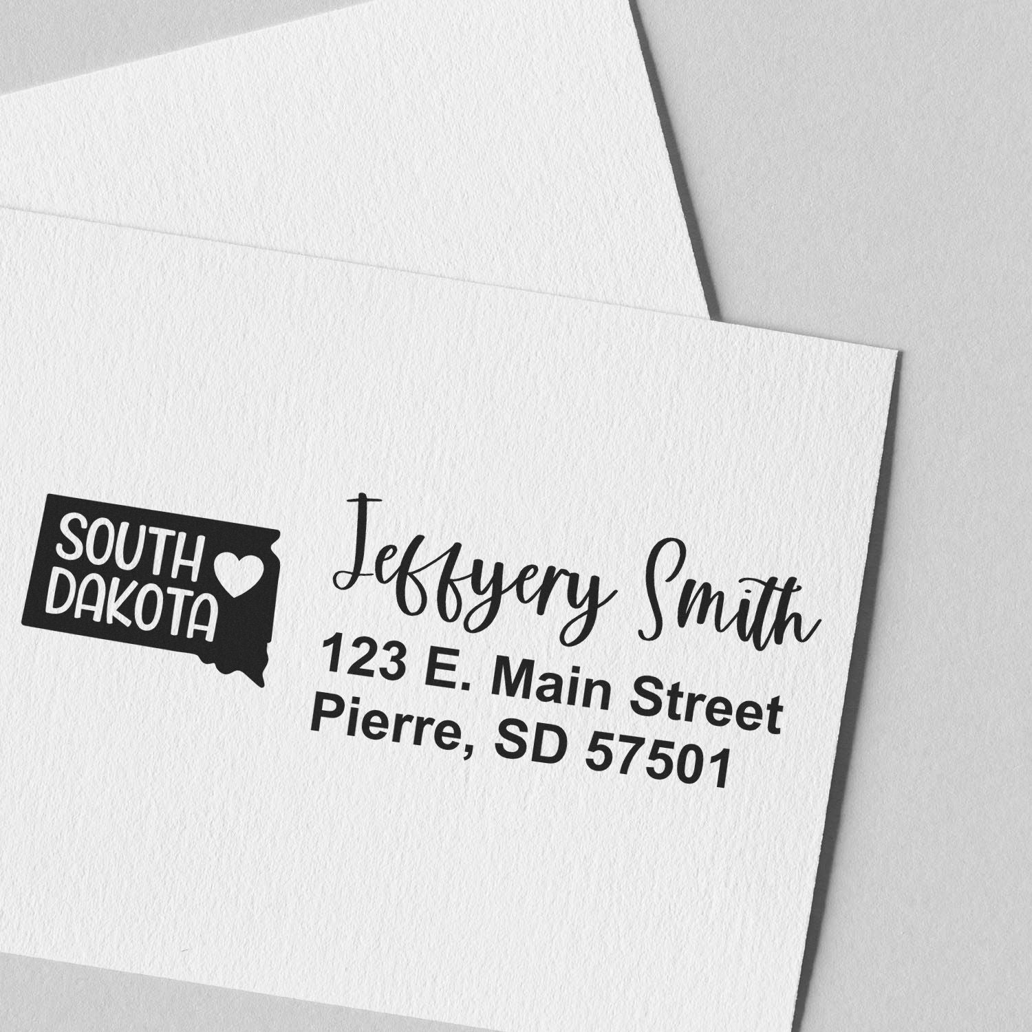 State Love of South Dakota Custom Address Stamp Self-Inking on white paper, featuring a map outline with heart and personalized address in elegant font.