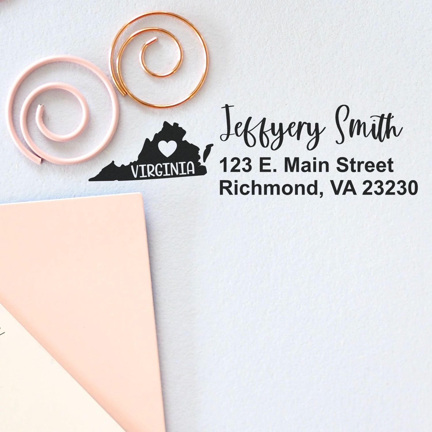 State Love of Virginia Custom Address Stamp Self-Inking on paper, featuring a heart over Virginia map, personalized with name and address. Includes decorative paper clips and pastel envelopes.