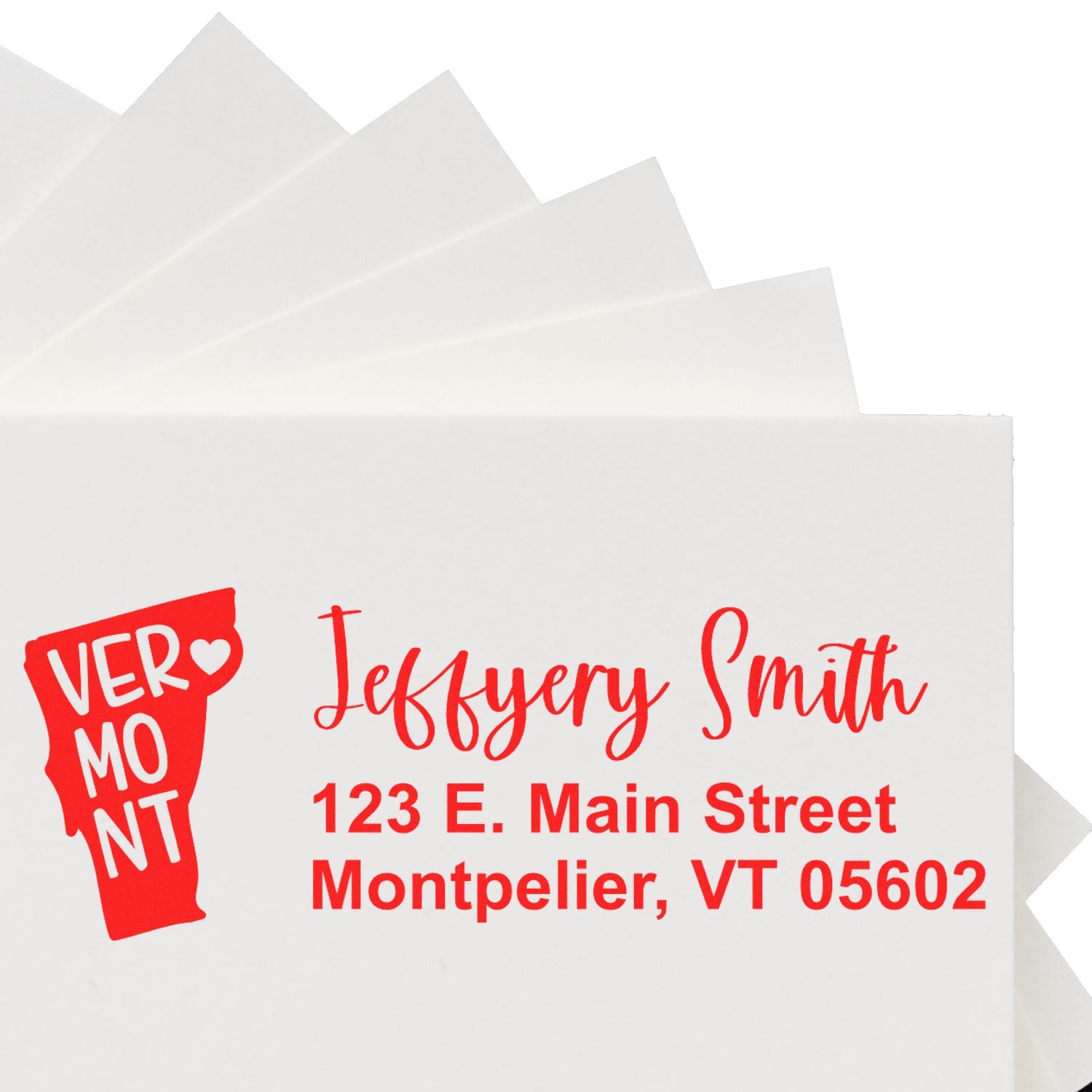 Envelopes with red text featuring the Vermont State Love Personalized Address Stamp, displaying a Vermont state outline and address for Jeffery Smith, 123 E. Main Street, Montpelier, VT 05602.