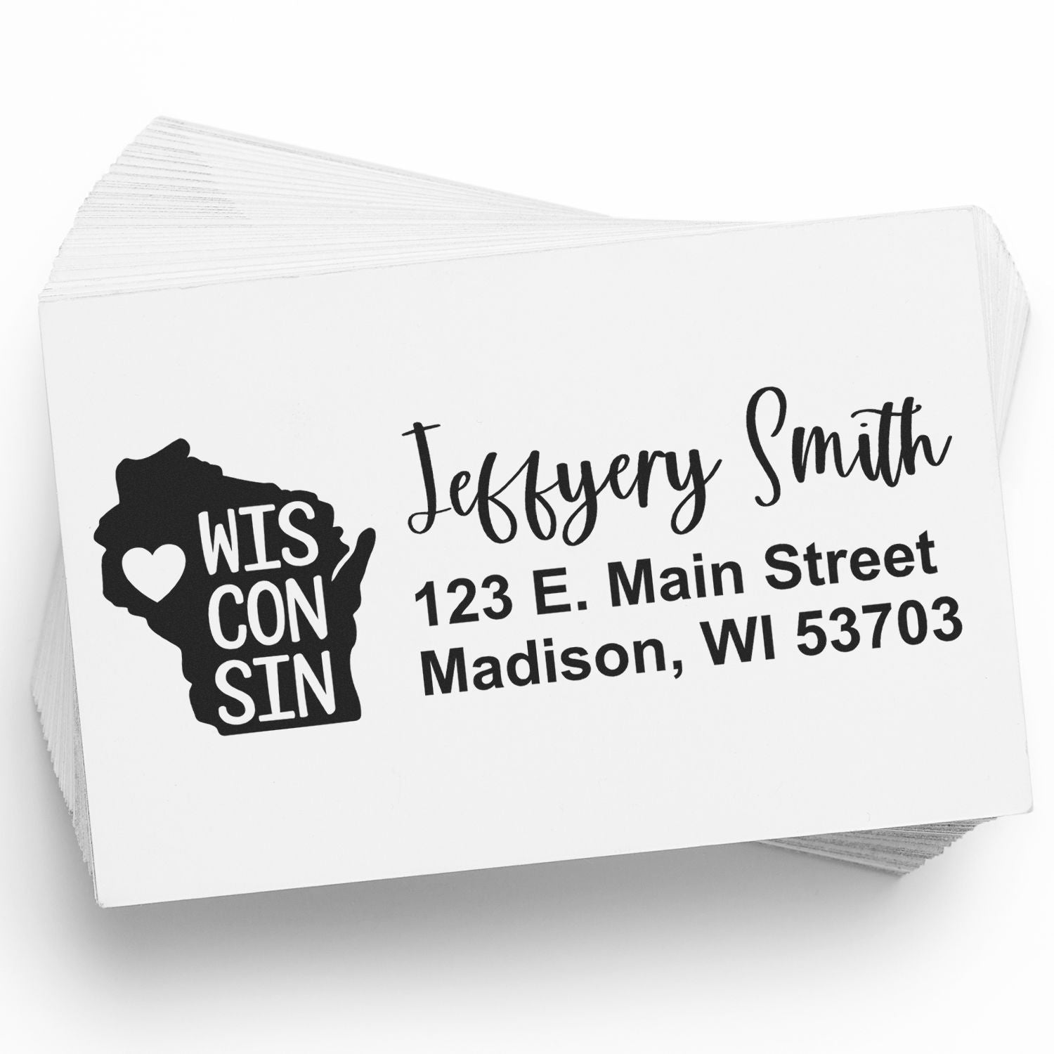 Wisconsin State Love Personalized Address Stamp on a stack of envelopes, featuring a heart design within the state outline and custom address text for Jeffery Smith, Madison, WI.