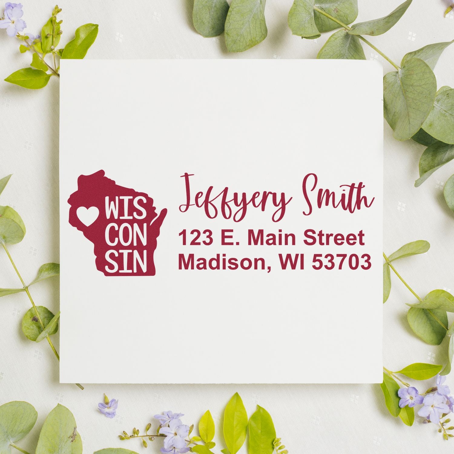 Slim Wisconsin Custom Address Stamp for Envelopes displayed on a white card with floral border. Features a red Wisconsin state outline and personalized address in elegant script.