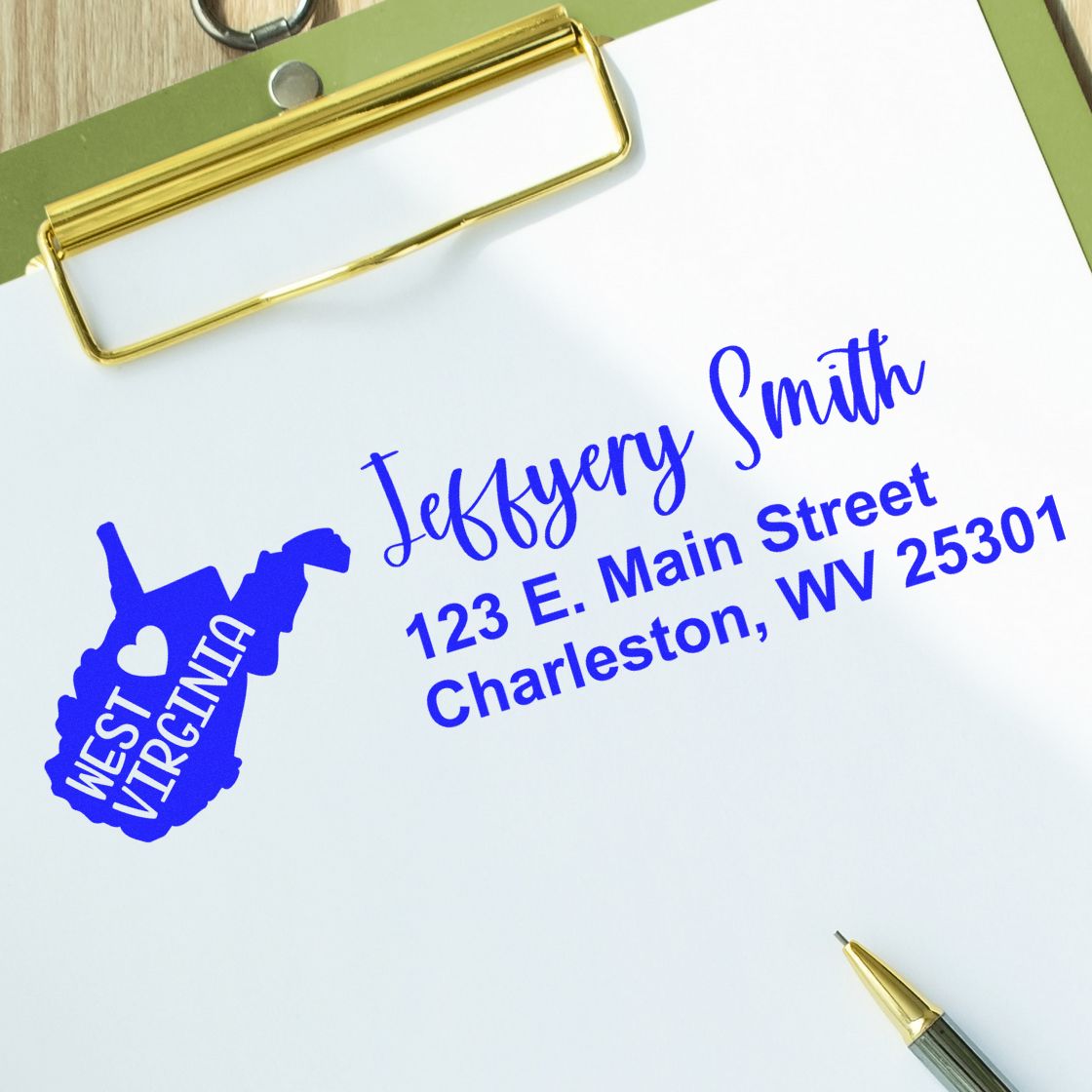 West Virginia State Love Personalized Address Stamp on paper with blue ink, featuring a heart and state outline. Includes name and address: Jeffery Smith, 123 E. Main Street, Charleston, WV 25301.