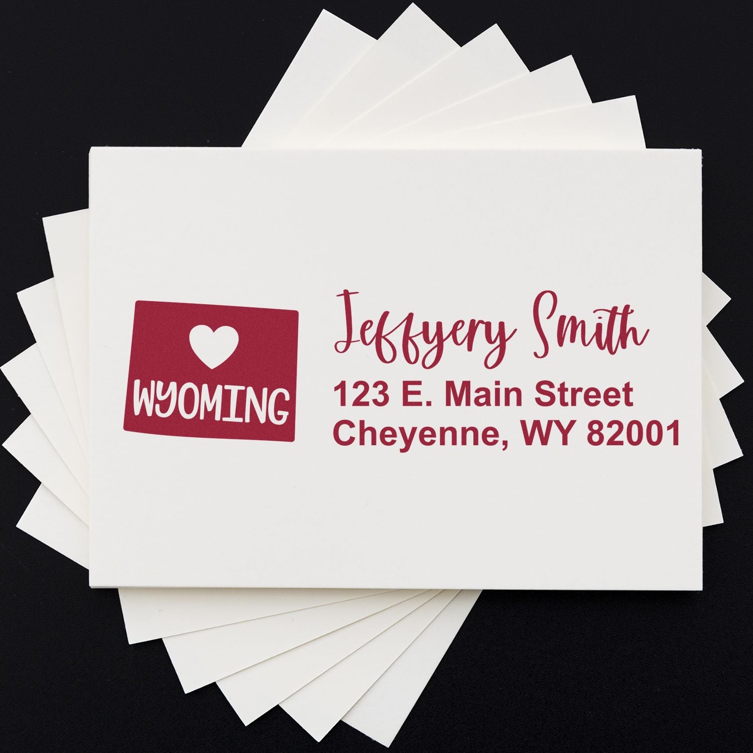 State Love of Wyoming Custom Address Stamp Self-Inking on white envelope, featuring a heart and Wyoming design, with red text for name and address: Jeffery Smith, 123 E. Main Street, Cheyenne, WY 82001.