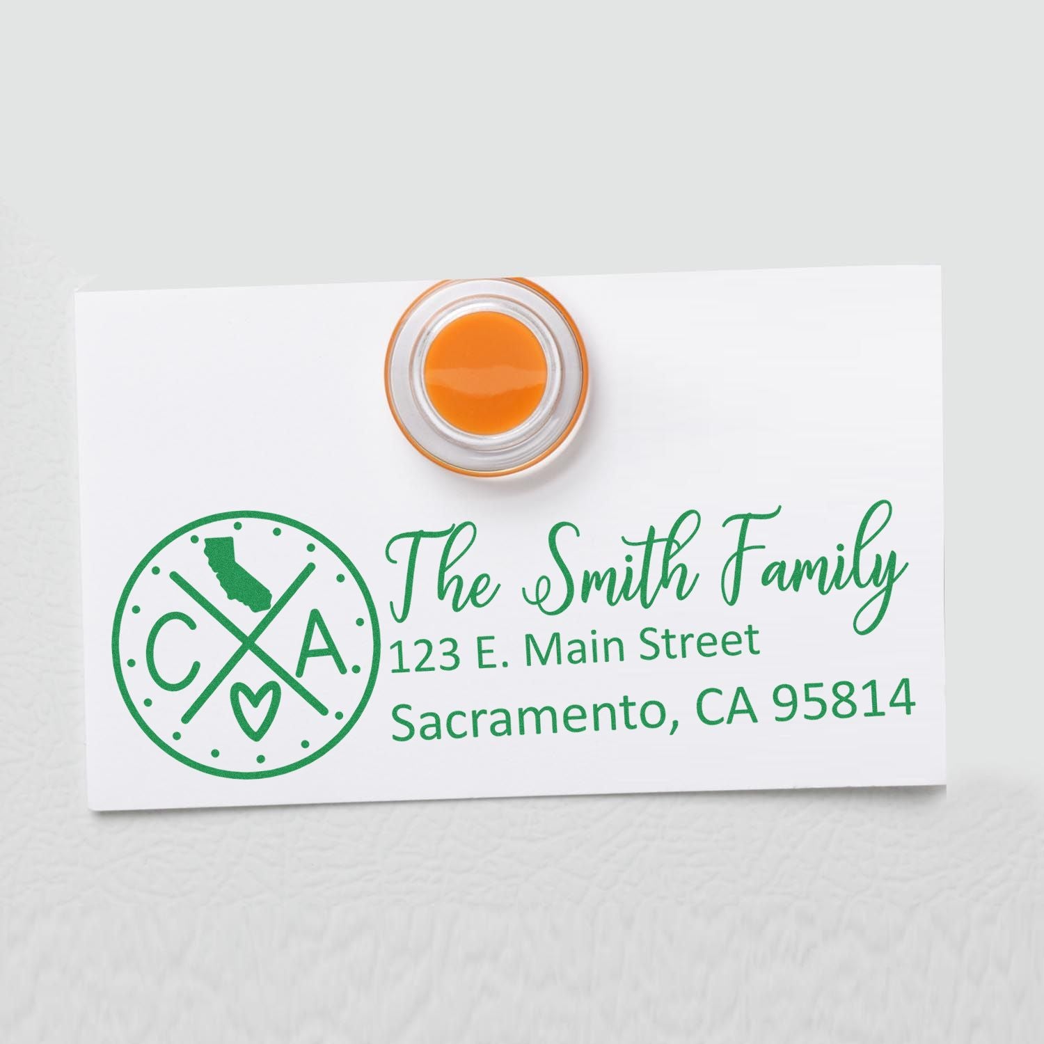 PSI Pre-Inked California State Pride Customized Address Stamp on white card with green text, featuring a California map and heart design, showcasing The Smith Family address in Sacramento, CA.