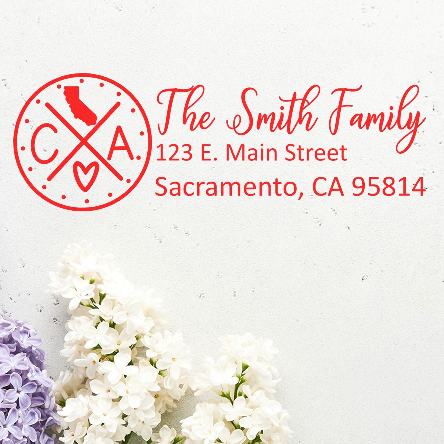 California State Pride Customized Address Stamp featuring a red design with CA and a heart, personalized with The Smith Family and address, displayed on a white background with lilac flowers.