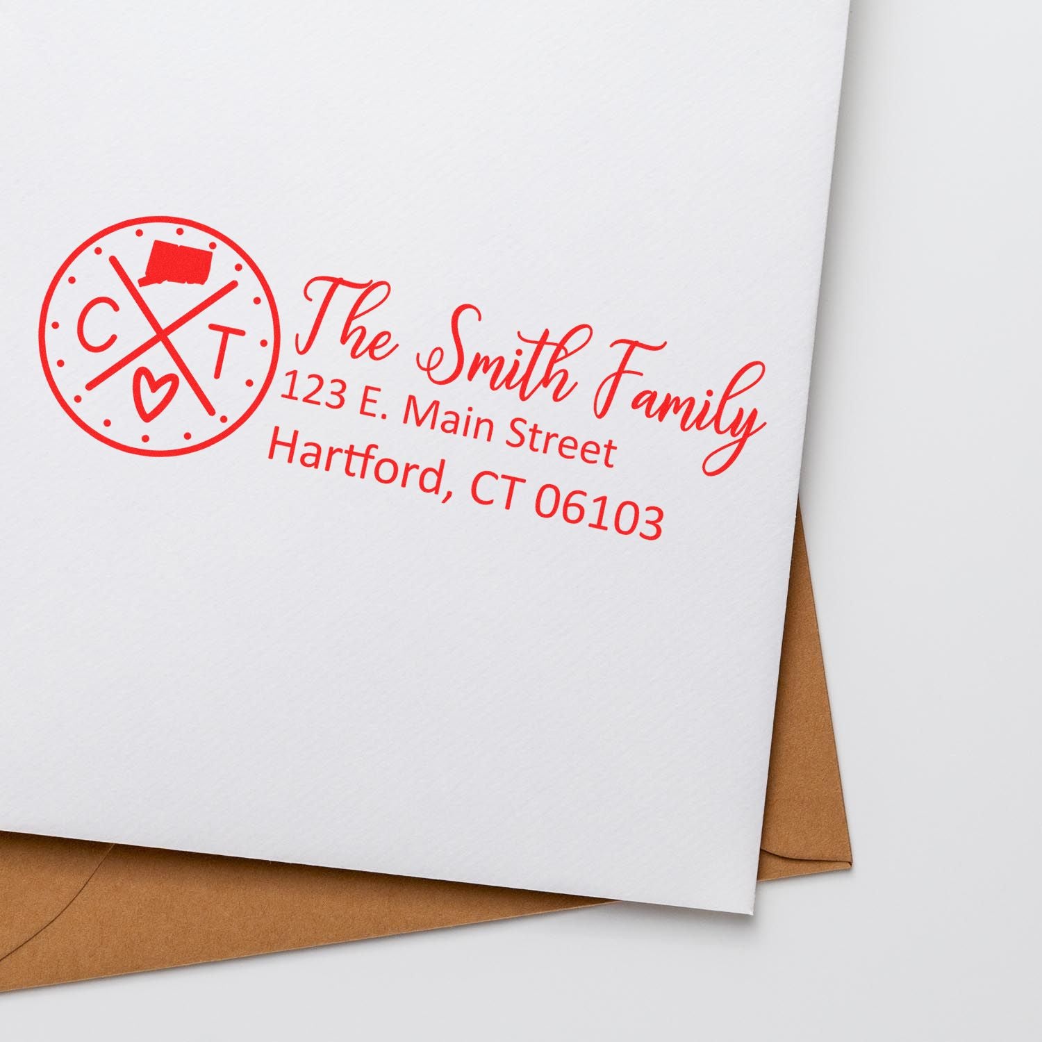 Connecticut State Pride Customized Address Stamp in red ink on an envelope, featuring a circular CT design and personalized address for The Smith Family, Hartford, CT.