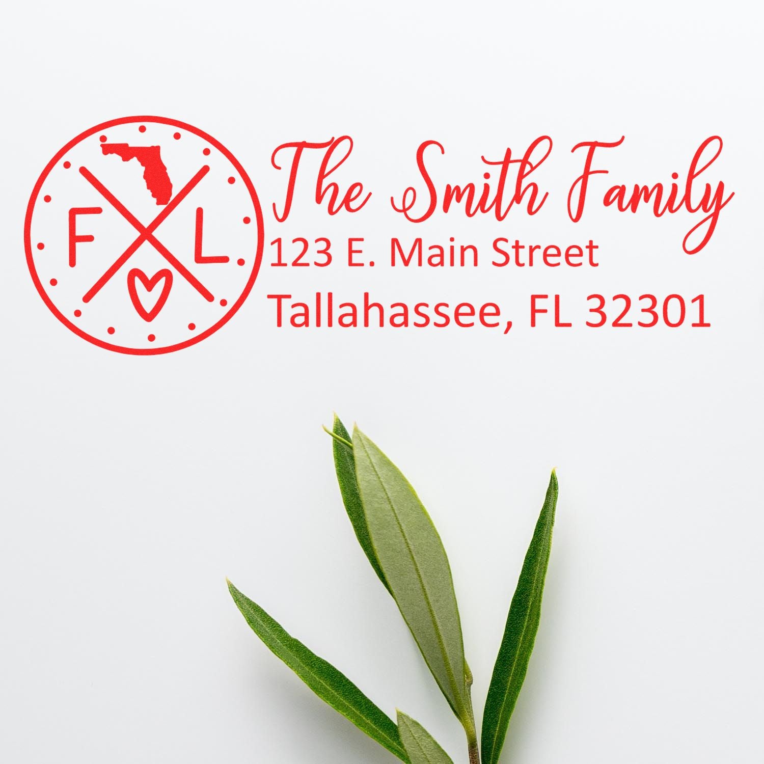 Slim Florida Customized Pre-Inked Address Stamp with red text showing The Smith Family, 123 E. Main Street, Tallahassee, FL 32301 beside a simple Florida-themed logo on a white background.