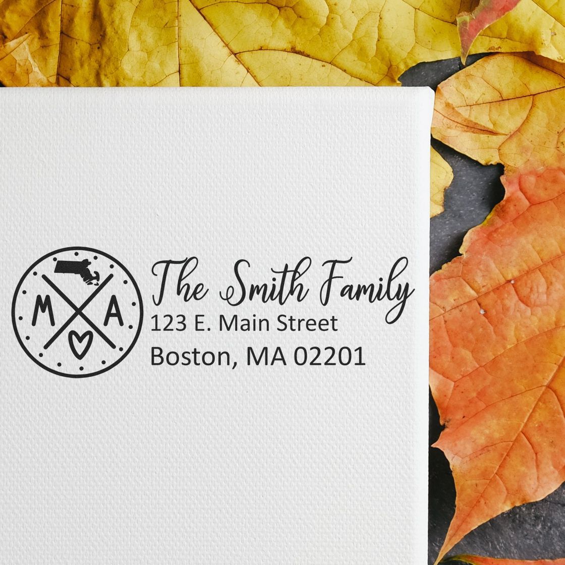 Massachusetts State Pride Customized Address Stamp on white paper, featuring a circular design with MA and a heart, surrounded by autumn leaves.