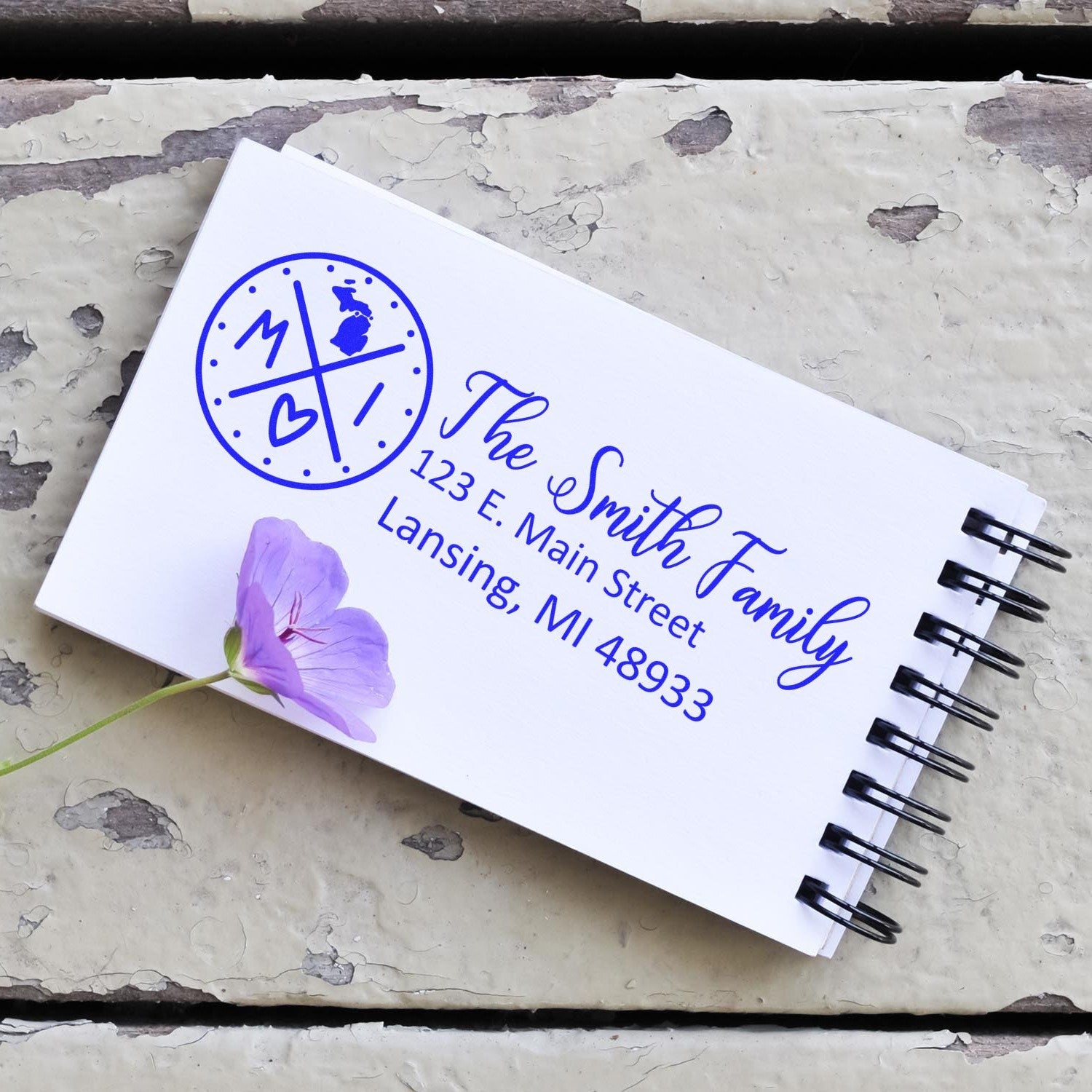 Michigan State Pride Customized Address Stamp on a notepad with The Smith Family and a purple flower, showcasing a personalized design with a Michigan theme.