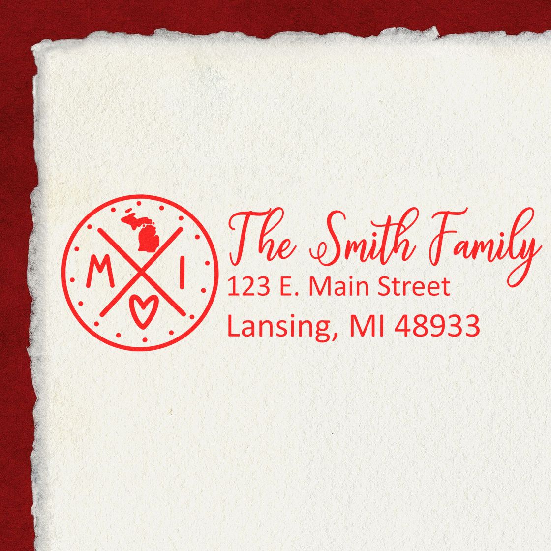 PSI Pre-Inked Michigan State Pride Customized Address Stamp on paper, featuring a red Michigan emblem and personalized address for the Smith Family, 123 E. Main Street, Lansing, MI 48933.