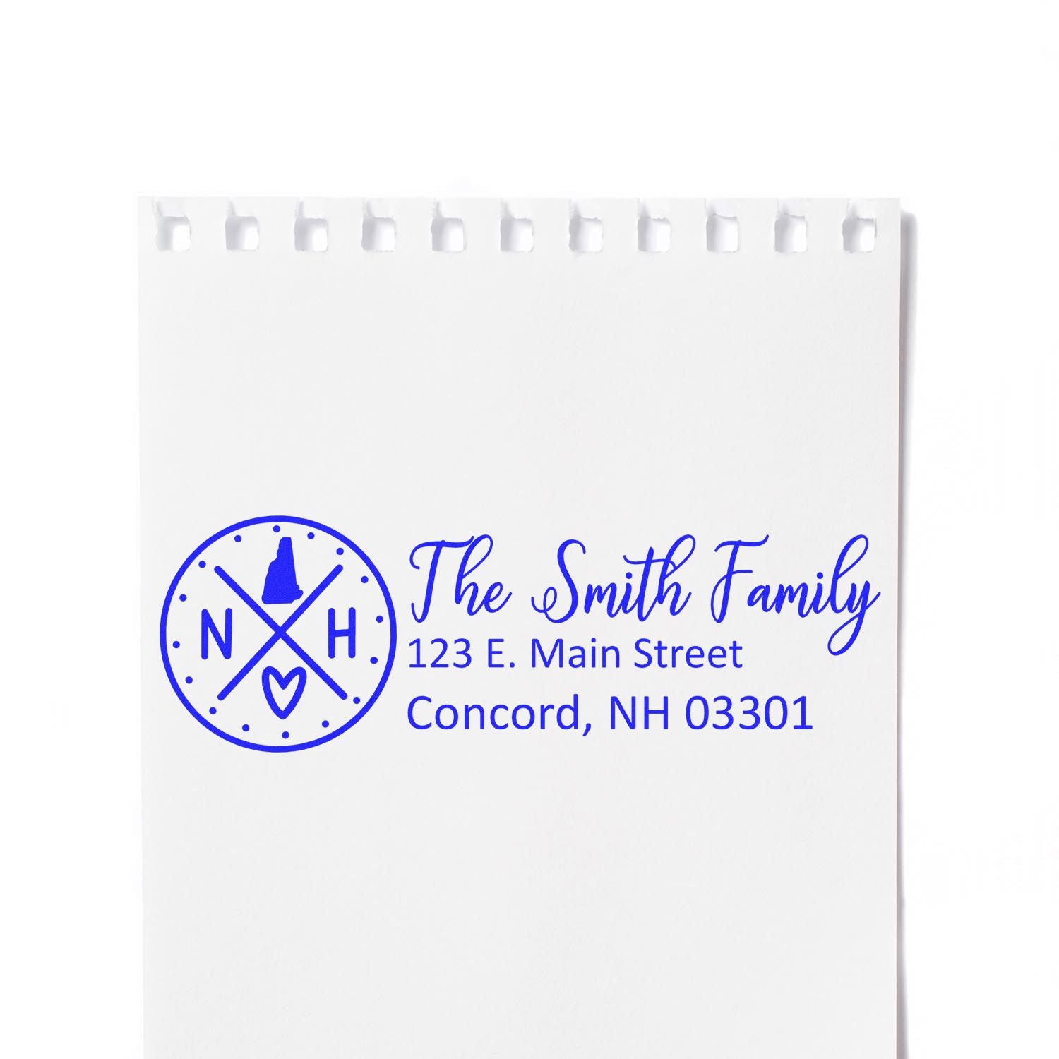 Slim New Hampshire Customized Pre-Inked Address Stamp on white paper, featuring a blue design with The Smith Family and an address in Concord, NH.