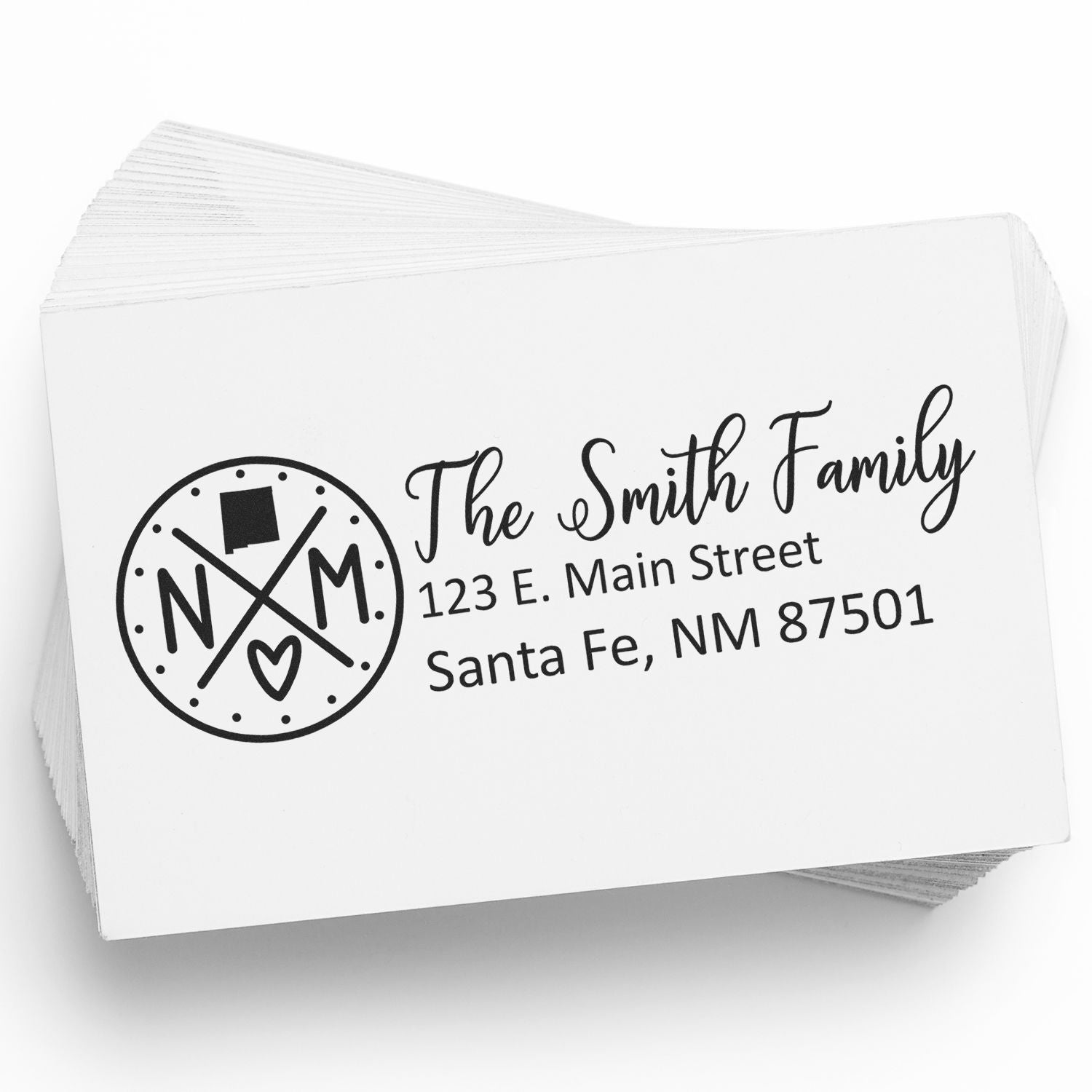 New Mexico State Pride Customized Address Stamp on a stack of envelopes, featuring a circular NM design and personalized address for the Smith Family in Santa Fe, NM.