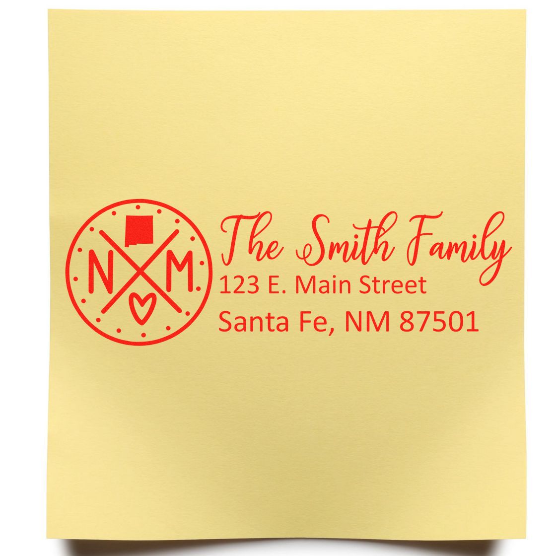 New Mexico State Pride Customized Address Stamp on yellow paper, featuring a red circular design with NM and a heart, alongside personalized address details for the Smith Family in Santa Fe.