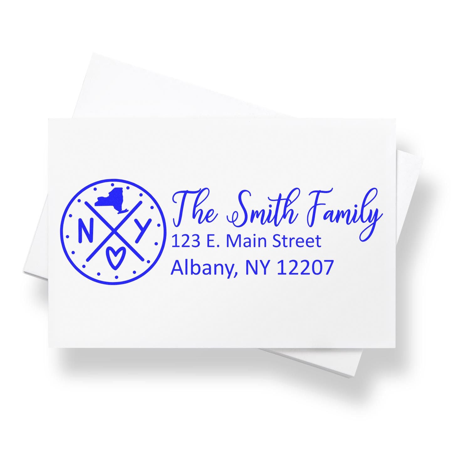 Slim New York Customized Pre-Inked Address Stamp on white envelope, featuring a blue design with The Smith Family and an address in Albany, NY. Perfect for personalized mailing needs.