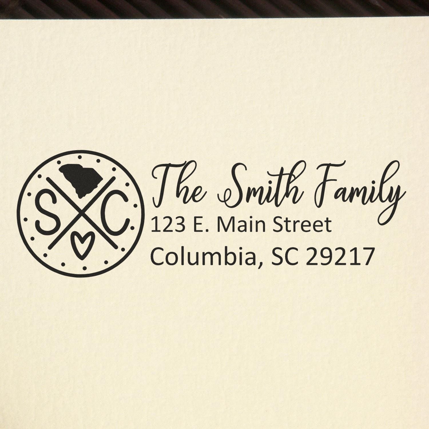 PSI Pre-Inked South Carolina State Pride Customized Address Stamp featuring a circular design with SC and a heart, personalized with The Smith Family, 123 E. Main Street, Columbia, SC 29217.