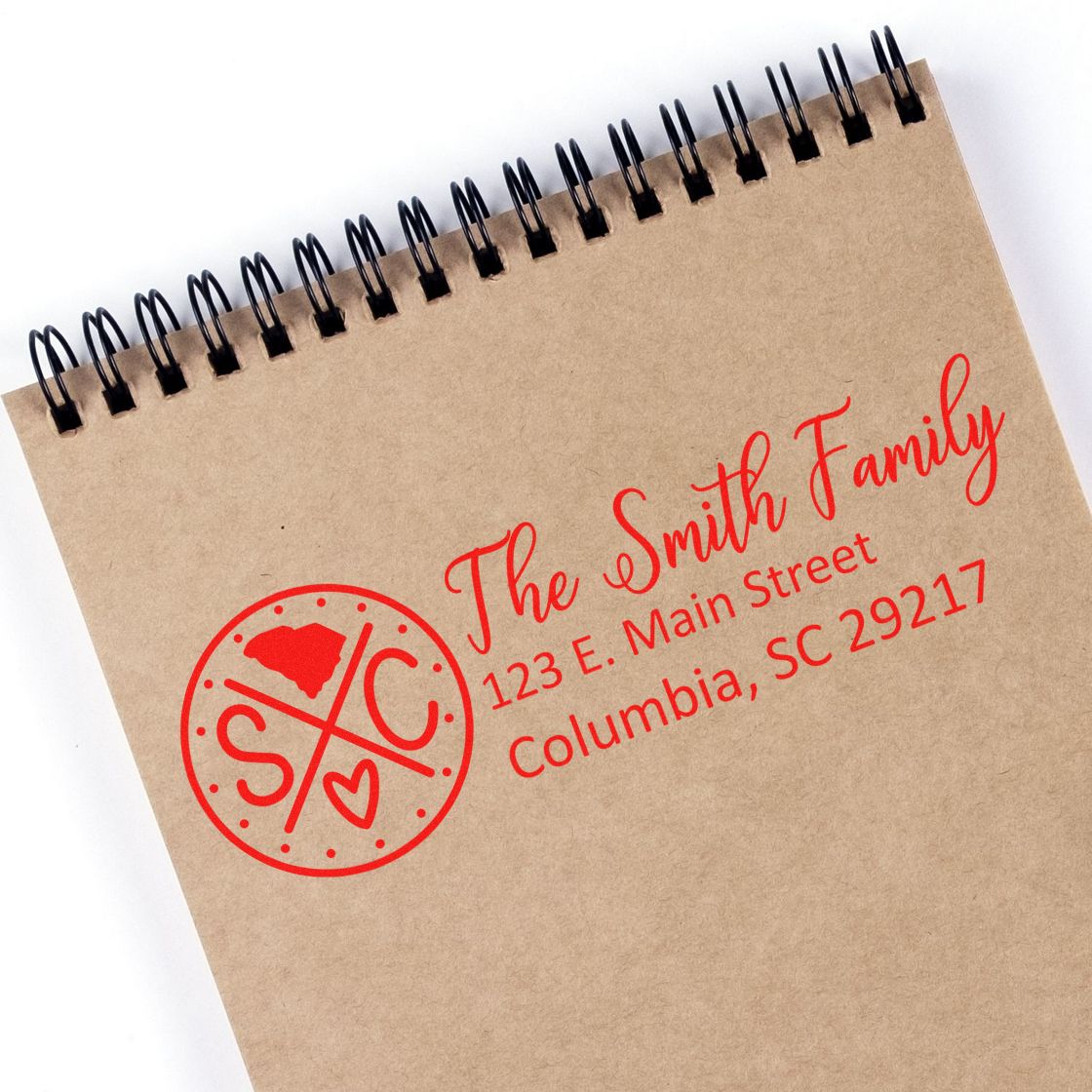 South Carolina State Pride Customized Address Stamp on a notebook, featuring a red design with The Smith Family and an address in Columbia, SC.