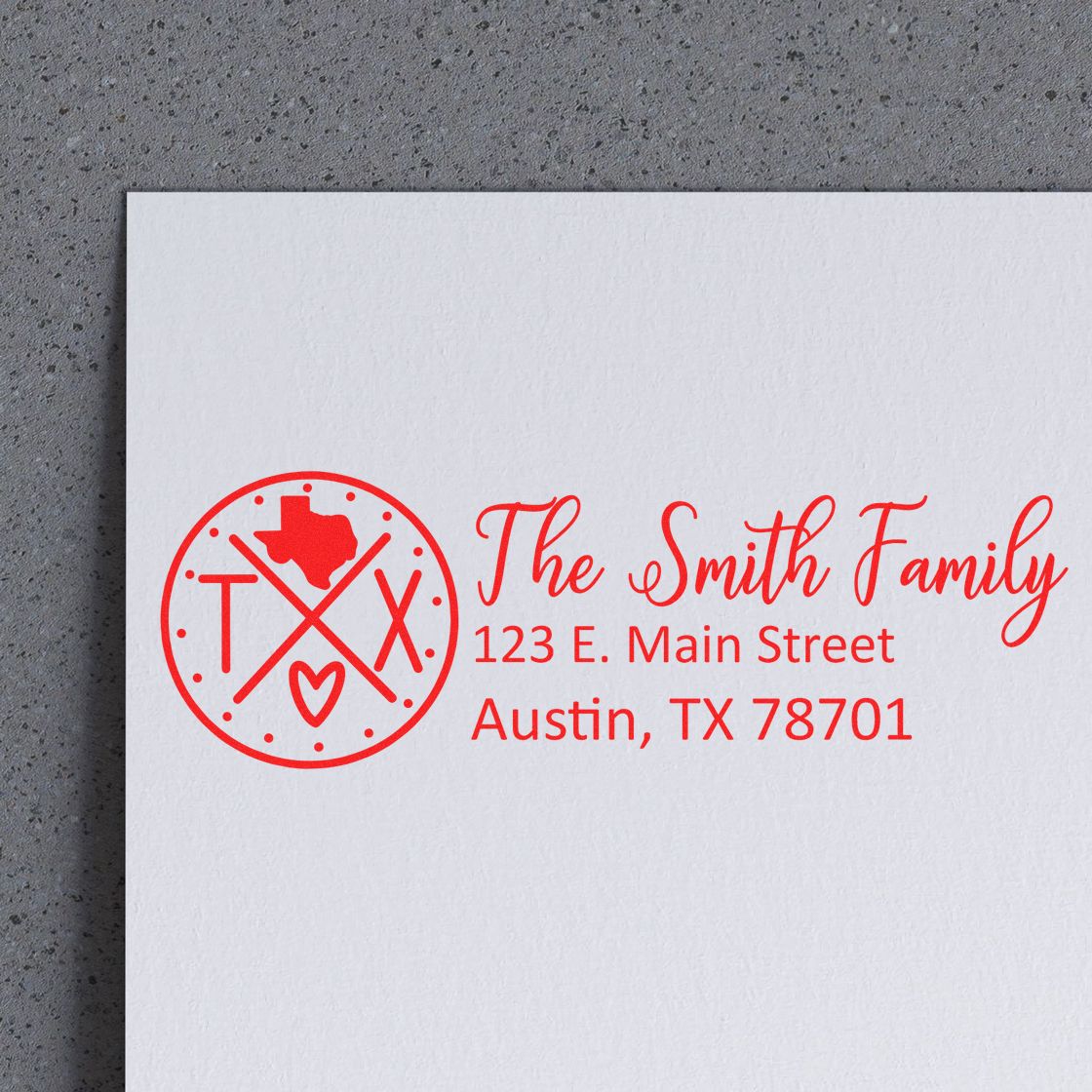 Texas State Pride Customized Address Stamp in red ink on white paper, featuring a circular design with a Texas map, heart, and crossed lines, displaying The Smith Family and an Austin address.