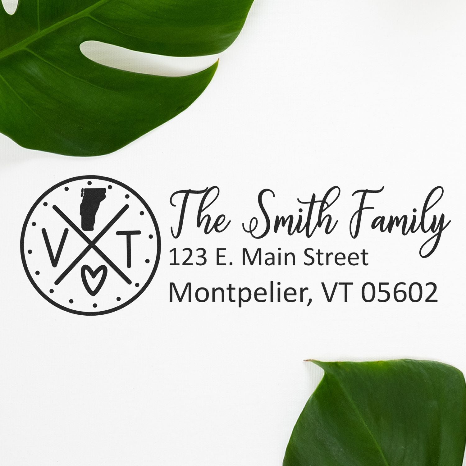 Vermont State Pride Customized Address Stamp featuring a circular design with 'VT' and a heart, personalized with 'The Smith Family' address. Displayed on a white background with green leaves.