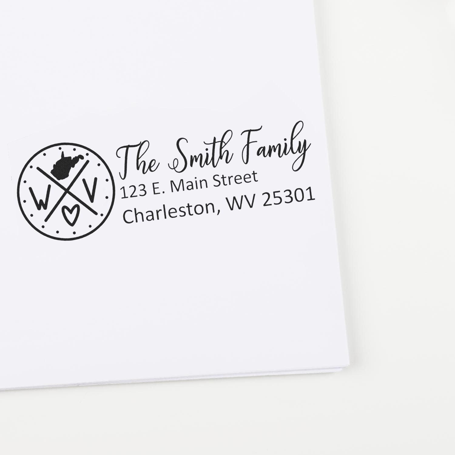 West Virginia State Pride Customized Address Stamp on white envelope, featuring a circular WV design with heart and personalized address for The Smith Family, Charleston, WV 25301.