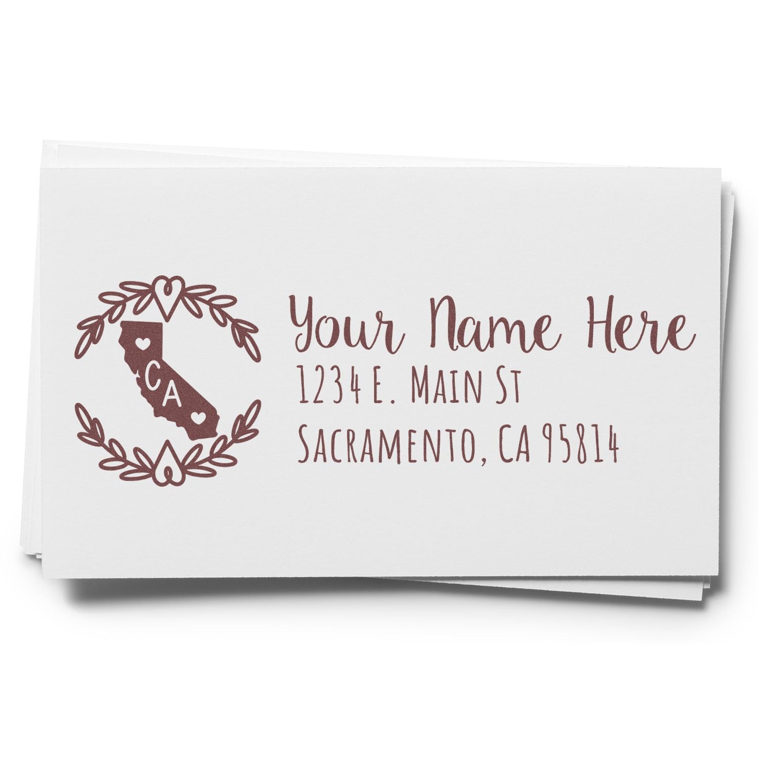 PSI Pre-Inked California State Customized Address Stamp on white paper, featuring a decorative California map with hearts and personalized address text in elegant font.