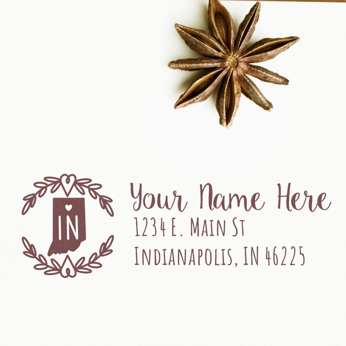 PSI Pre-Inked Indiana State Customized Address Stamp on white paper with decorative star anise. Features IN state outline and sample address in elegant font. Perfect for personalized mailings.