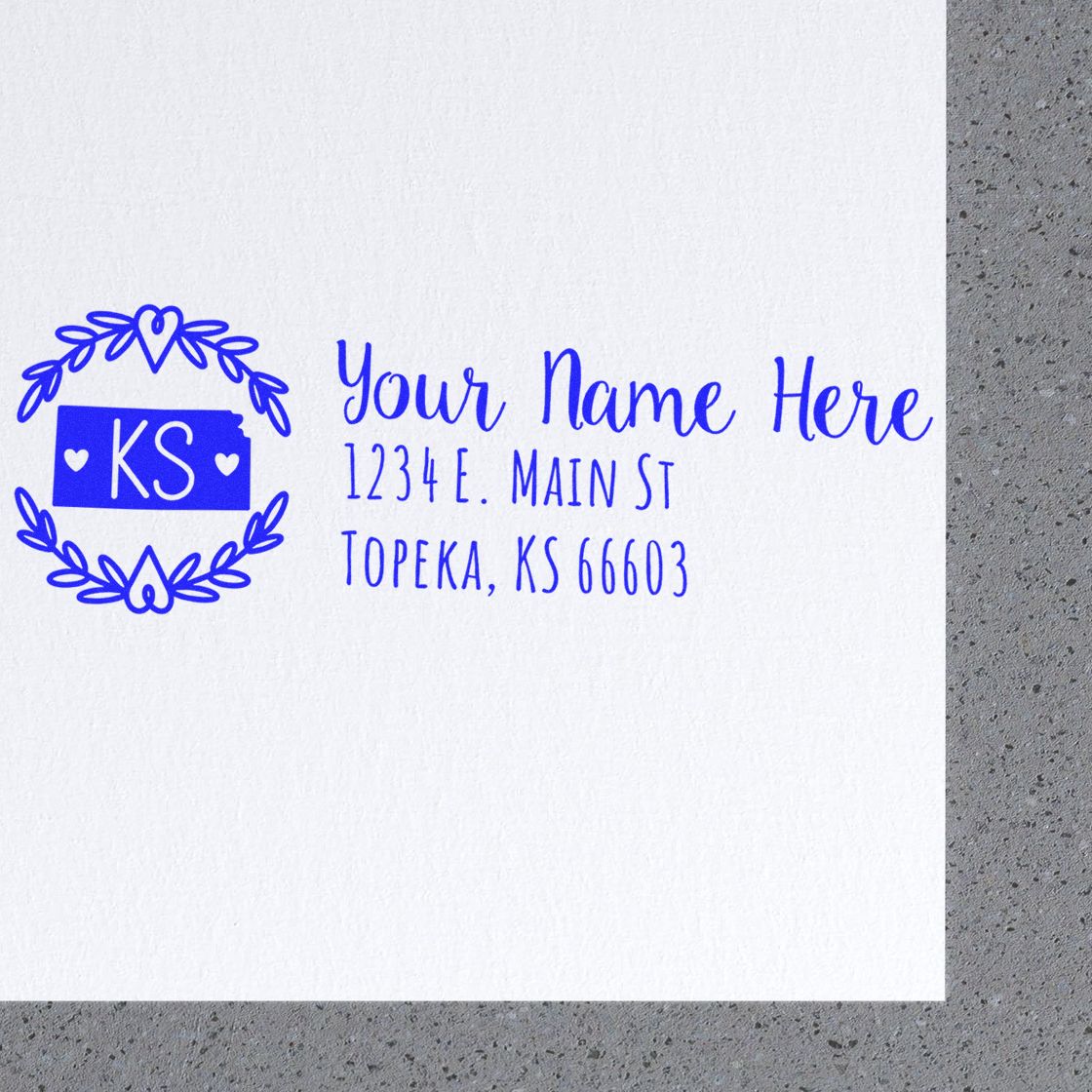 Kansas State Custom Return Address Stamp on white paper, featuring a blue design with KS in a decorative circle, and sample address text in elegant font. Perfect for personalized mailings.