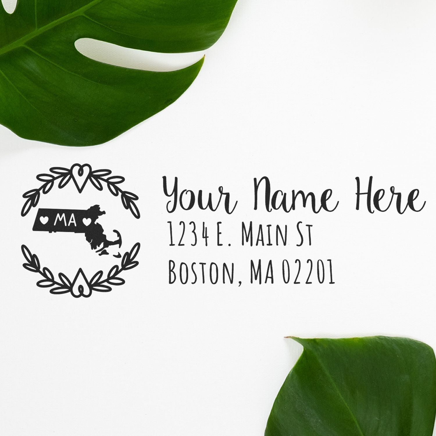 PSI Pre-Inked Massachusetts State Customized Address Stamp on white paper with a decorative state outline and sample address, surrounded by green leaves.