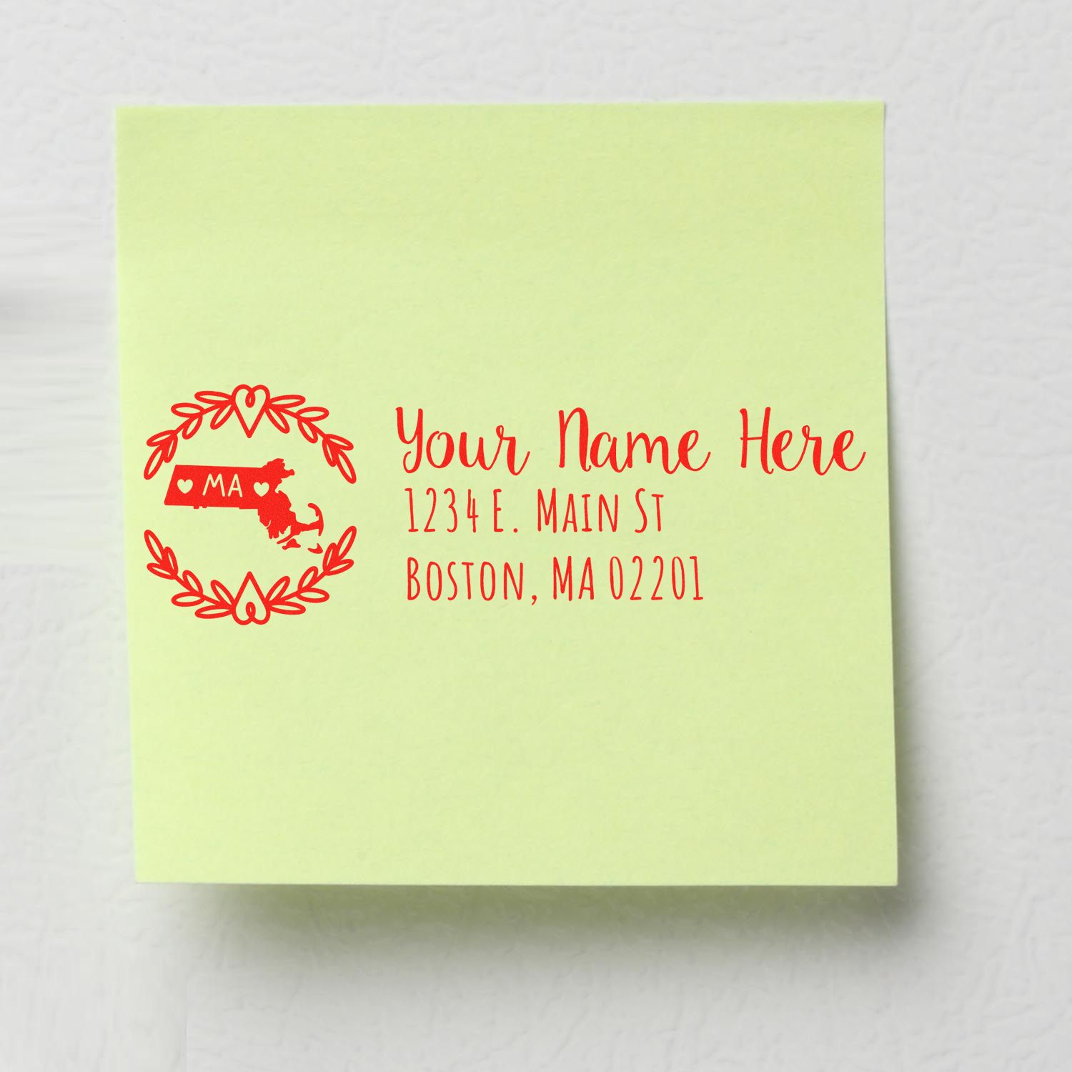 Green sticky note with a red Massachusetts State Custom Return Address Stamp design, featuring a map outline, hearts, and placeholder text for name and address in Boston, MA.