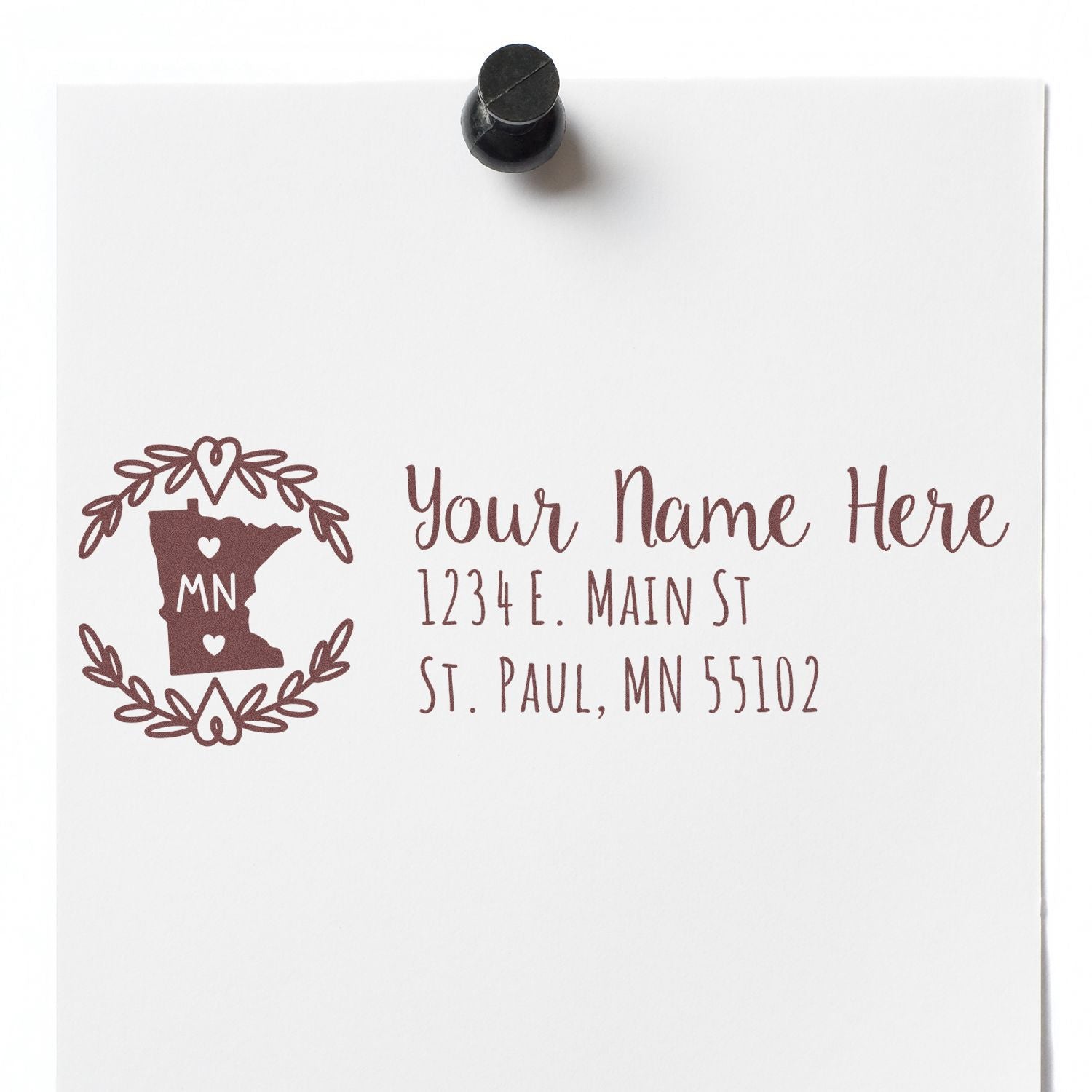 PSI Pre-Inked Minnesota State Customized Address Stamp on white paper, featuring a decorative Minnesota state outline with hearts and sample address text in elegant font.