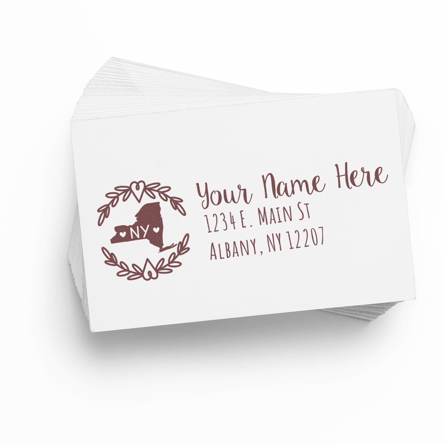 Stack of envelopes featuring the Slim New York Personalized Pre-Inked Address Stamp design, showcasing a New York state outline with decorative elements and customizable address text.