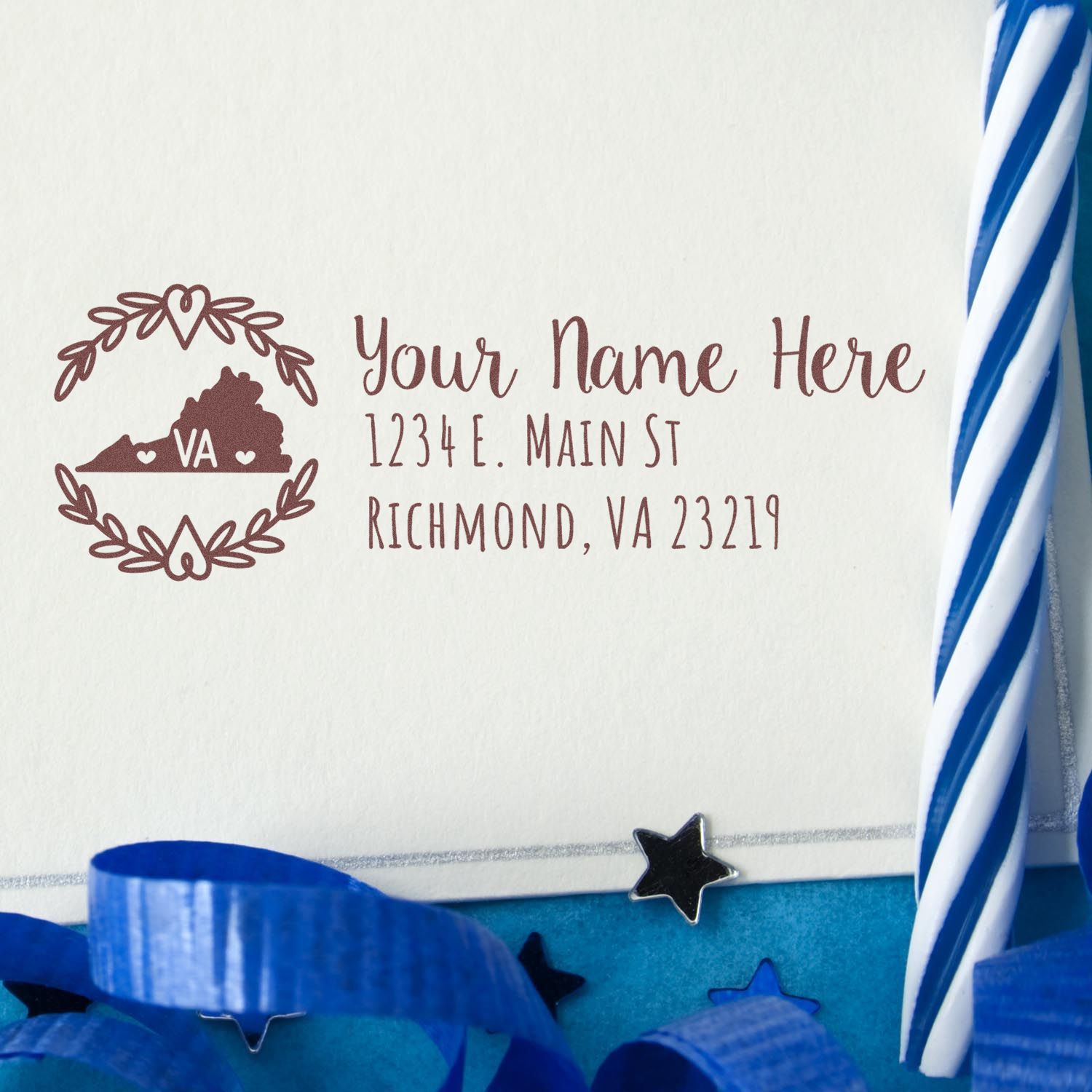 Virginia State Custom Return Address Stamp on an envelope with a Virginia outline and address. Surrounded by blue ribbon and stars, creating a festive look.