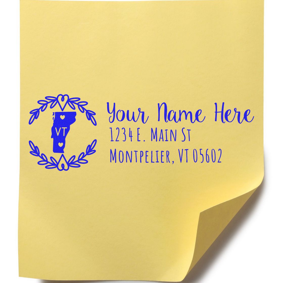 Yellow sticky note with a blue Vermont State Custom Return Address Stamp design, featuring a heart-accented Vermont outline and sample address text in elegant script.