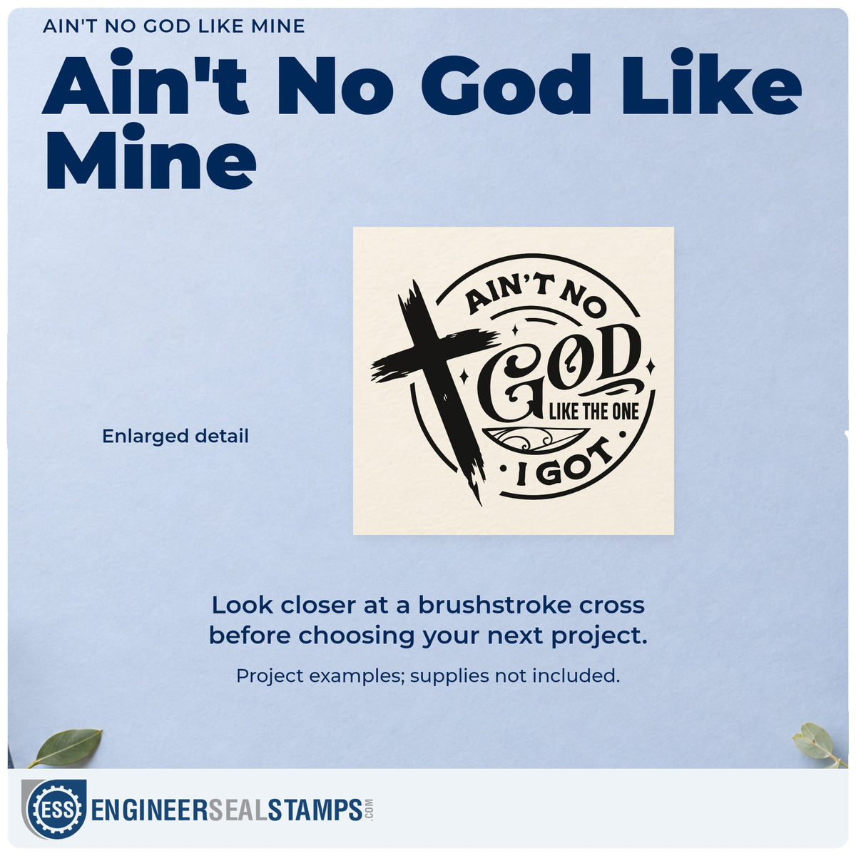 Enlarged detail of the Ain't No God Like Mine Slim Pre-Inked Stamp imprint. A brushstroke cross overlaps a circular design reading "Ain't no God like the one I got."