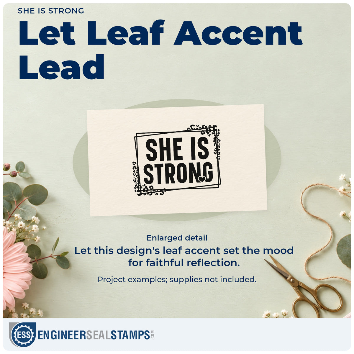 Enlarged detail of the Pre-Inked She Is Strong Botanical Lettering Stamp – PSI imprint. Leafy corners and a small heart accent bold "She is strong" lettering inside overlapping frames.
