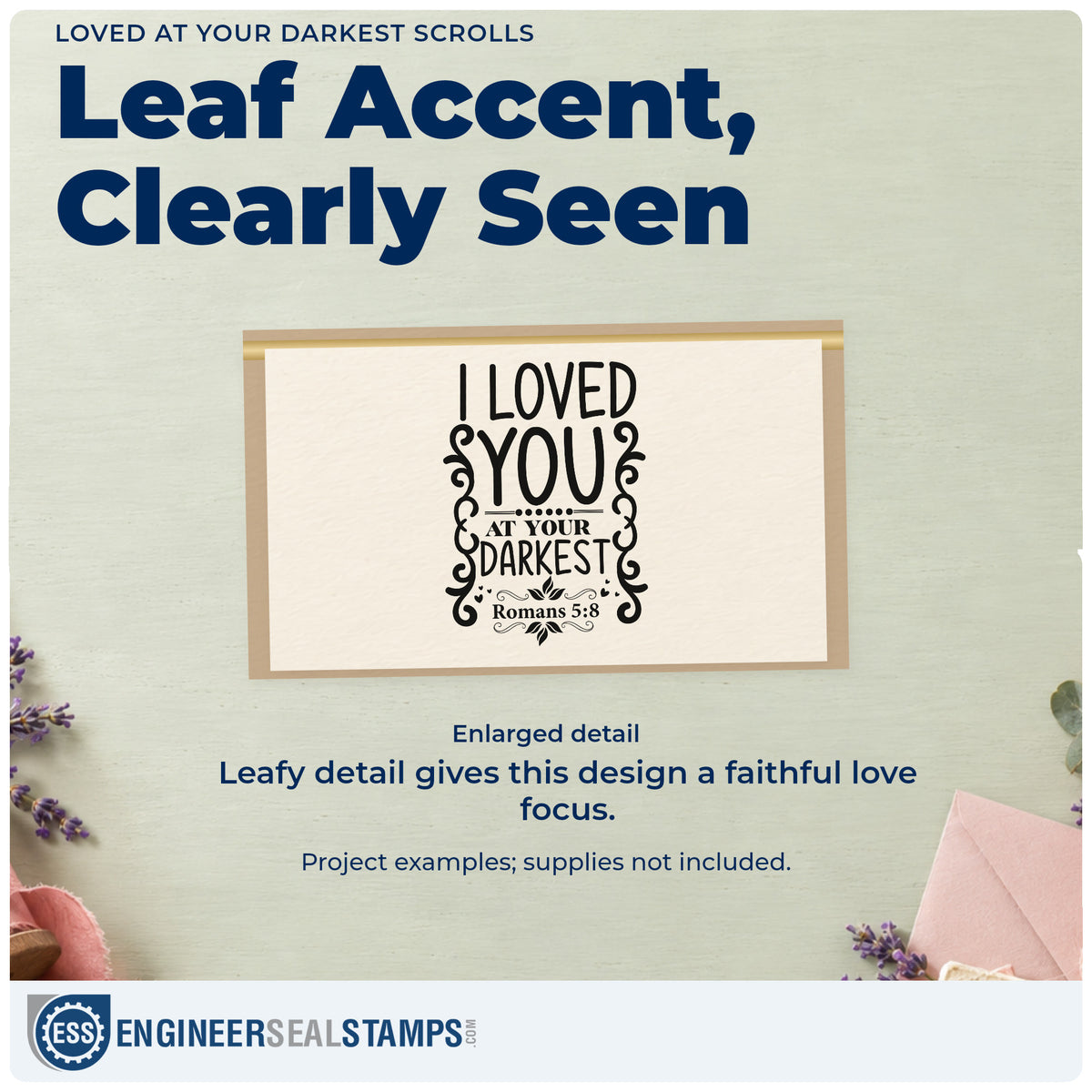 Enlarged detail of the Loved At Your Darkest Scrolls Leaf Accents Self-Inking Stamp imprint. Side scrolls and leafy details decorate "I loved you at your darkest," with Romans 5:8.