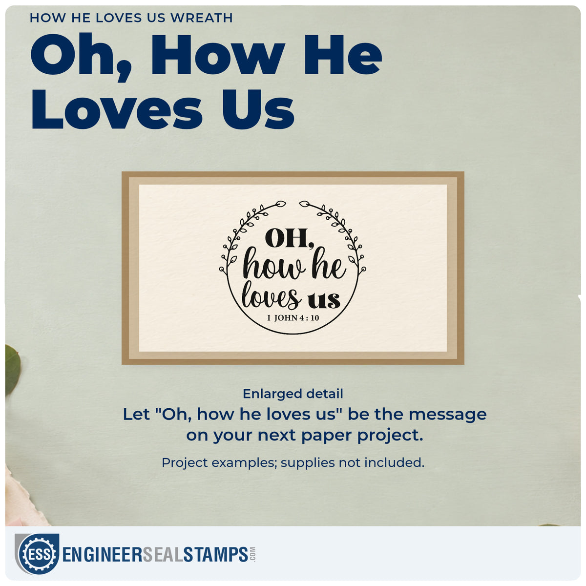 Enlarged detail of the How He Loves Us Wreath Hand Stamp – Duo imprint. Two curved leafy branches surround "Oh, how he loves us," with 1 John 4:10.