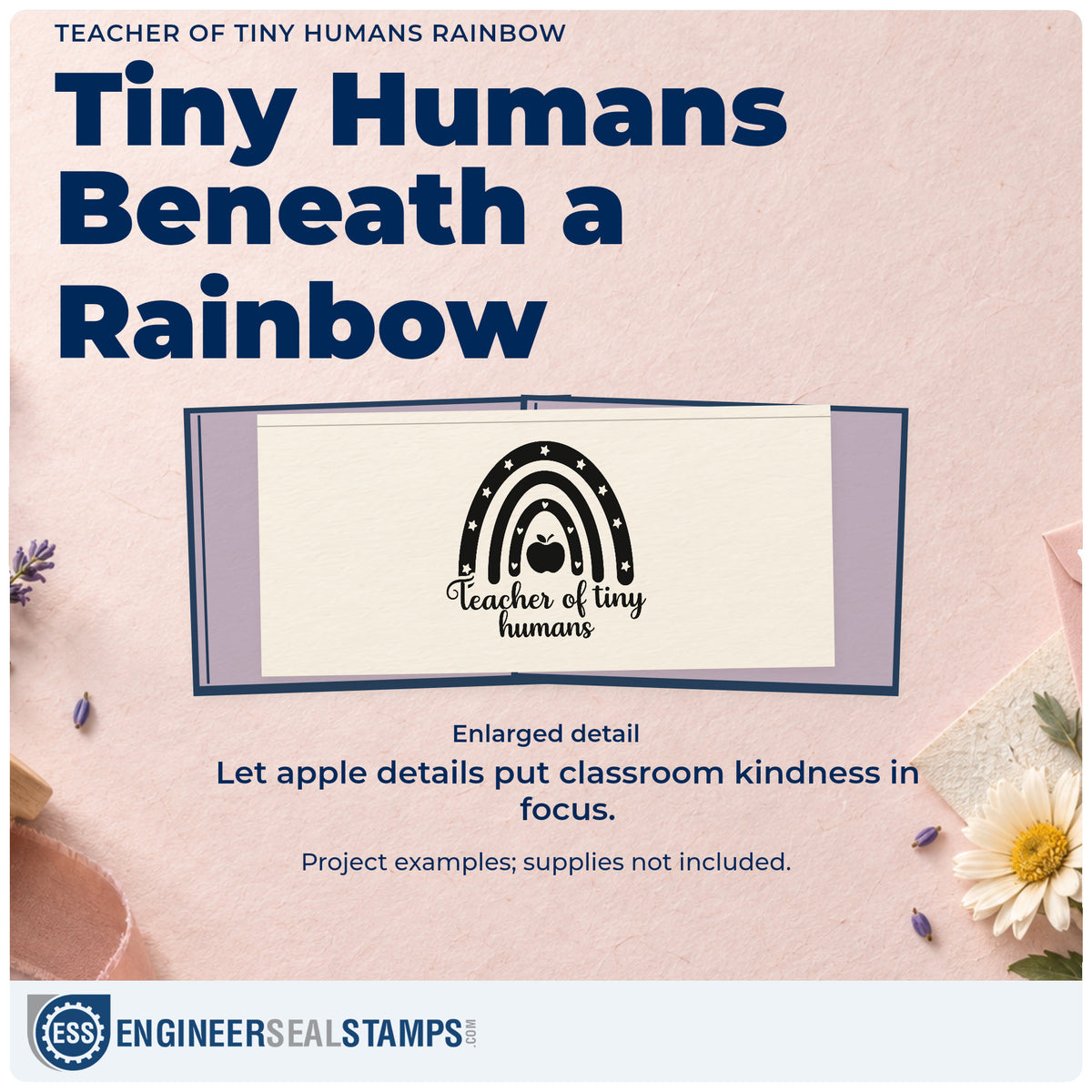 Enlarged detail of the Teacher Of Tiny Humans Rainbow Duo Hand Stamp imprint. A star-and-heart rainbow surrounds an apple above "Teacher of tiny humans."