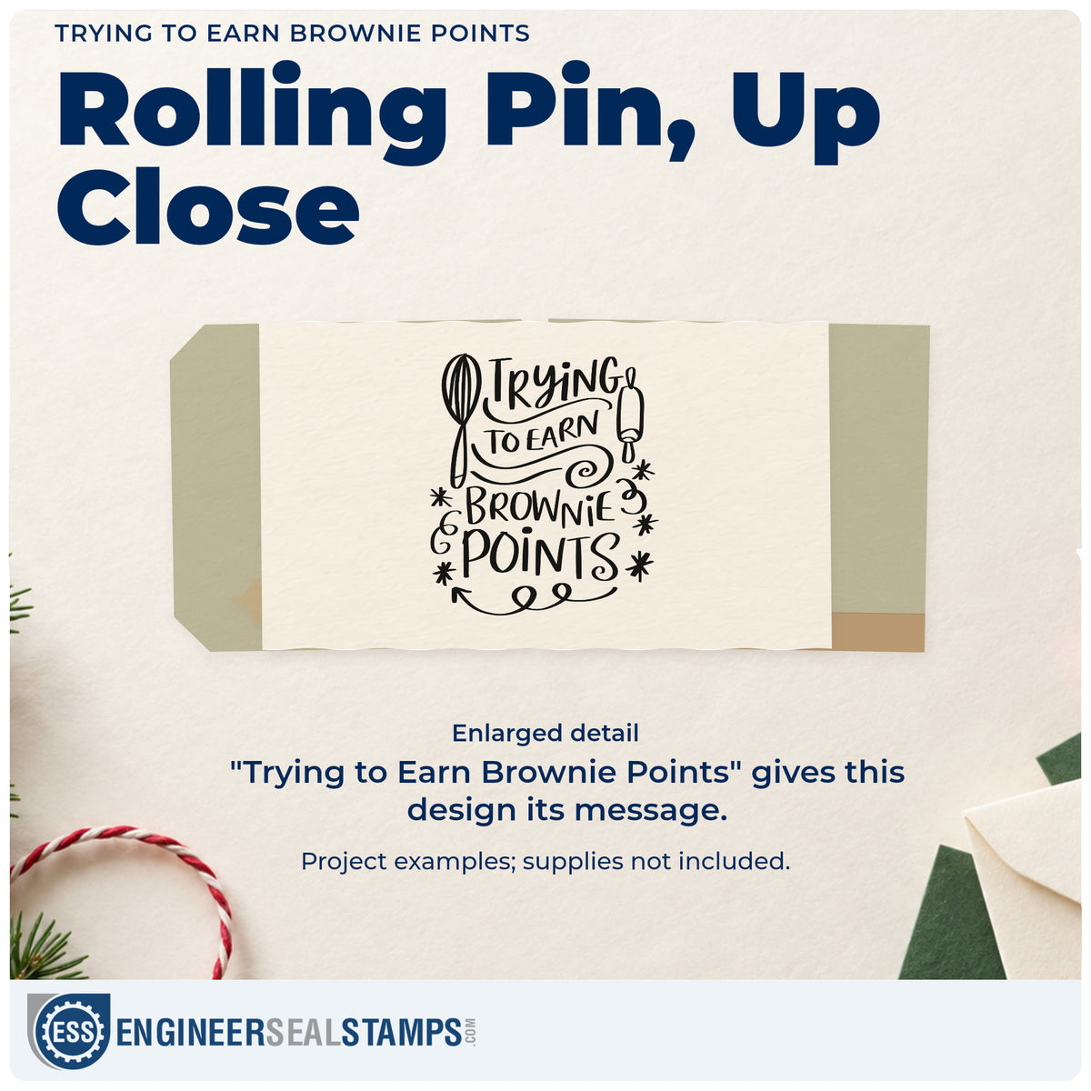 Enlarged detail of the Trying To Earn Brownie Points Stamp – Self-Inking imprint. “Trying to Earn Brownie Points” is framed by a whisk, rolling pin, stars, and a looping flourish.