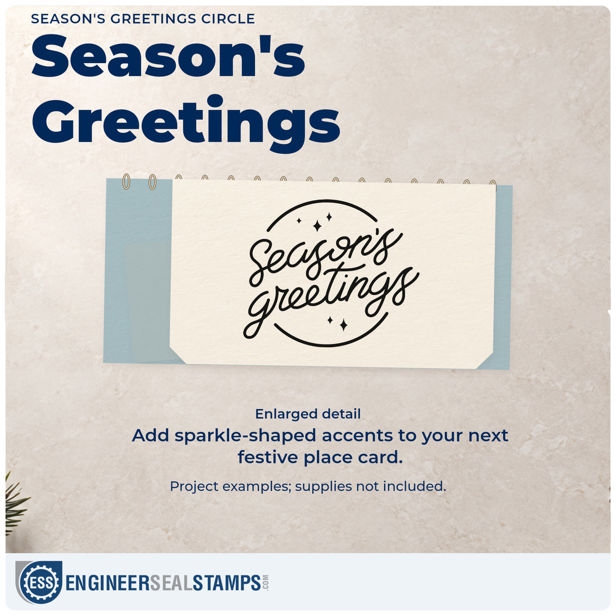 Enlarged detail of the Season's Greetings Circle Rubber Stamp – Wood Handle imprint. Script “Season's Greetings” sits between curved border lines with small sparkles.