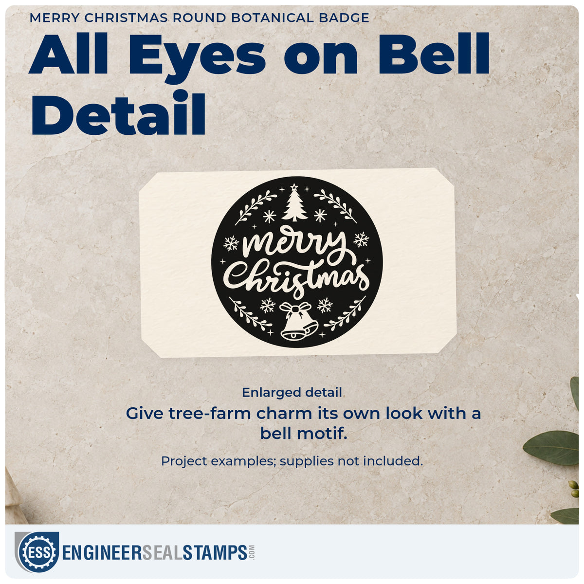Enlarged detail of the Merry Christmas Round Botanical Emblem Stamp – Wood Handle imprint. “Merry Christmas” fills a dark circular badge with a tree, snowflakes, bell, and leafy border.