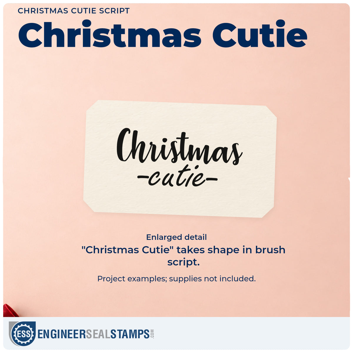 Enlarged detail of the Christmas Cutie Script PSI Pre-Inked Stamp imprint. “Christmas Cutie” appears in brush script with short dashes around the lower word.