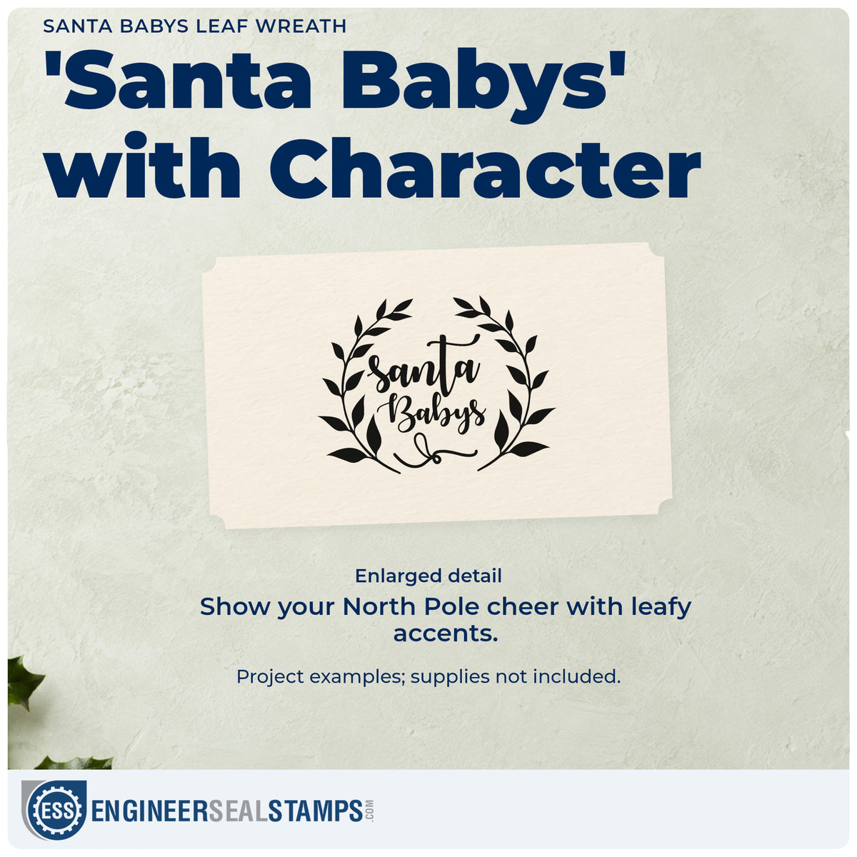 Enlarged detail of the Santa Babys Leaf Wreath Rubber Stamp – Duo Hand imprint. “Santa Babys” sits inside an open wreath of dark pointed leaves.