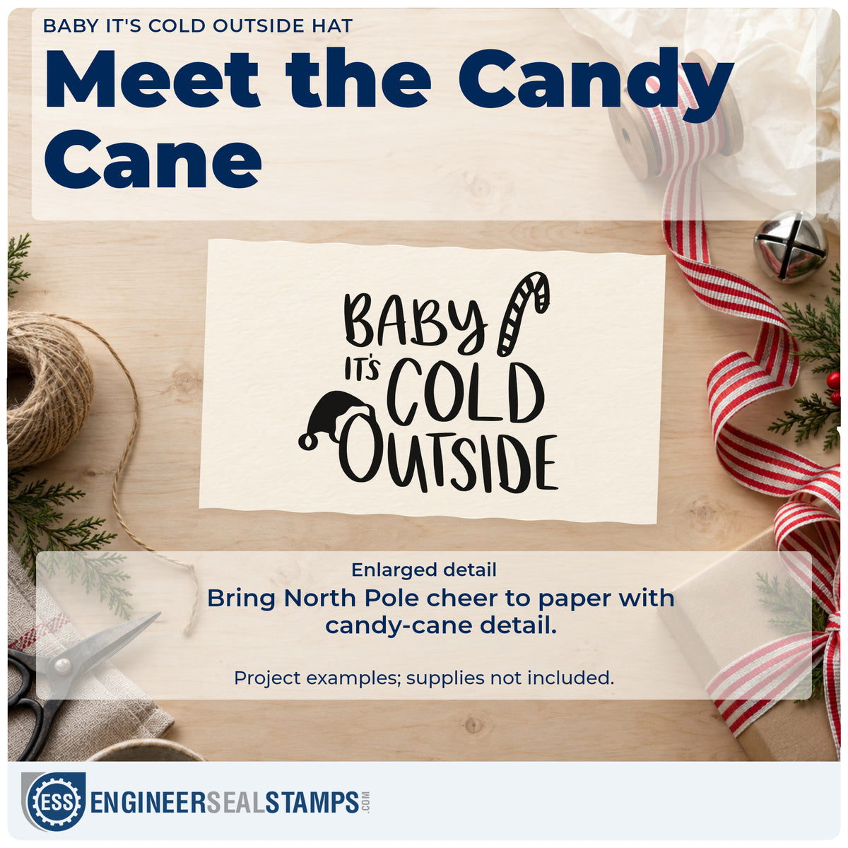Enlarged detail of the Baby It's Cold Outside Hat Candy Cane Wood Handle Stamp imprint. The words "Baby it's cold outside" appear with a Santa hat and candy cane.