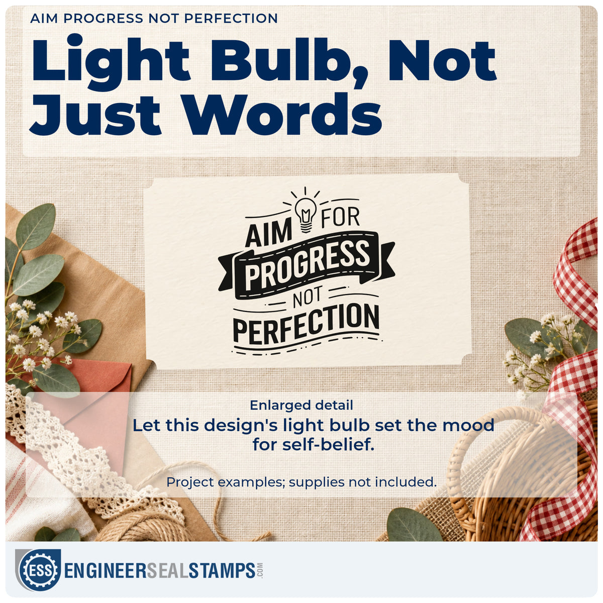Enlarged detail of the Self-Inking Aim For Progress Not Perfection Stamp imprint. AIM FOR PROGRESS NOT PERFECTION appears with a light bulb and dark ribbon banner.