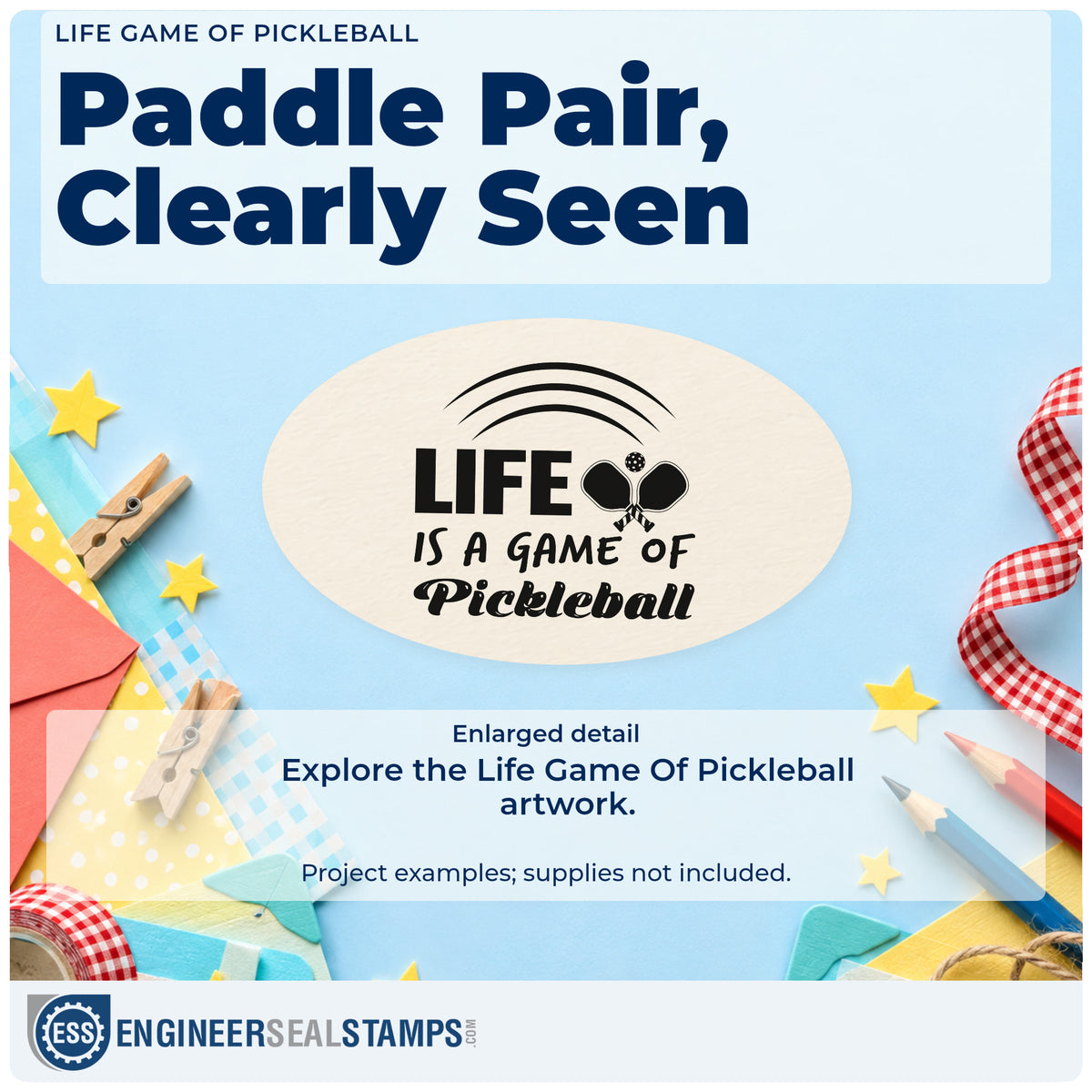 Enlarged detail of the Duo Hand Life Is A Game Of Pickleball Rubber Stamp imprint. LIFE IS A GAME OF Pickleball appears with crossed paddles and three curved lines above.