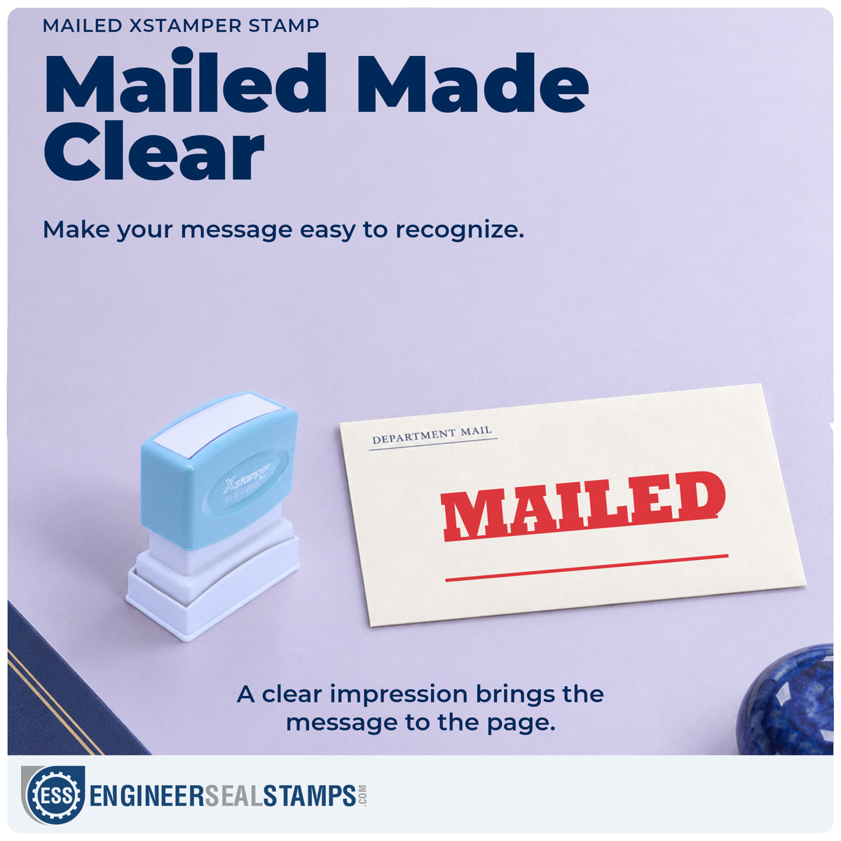 "Mailed" imprint on office paperwork beside the Xstamper Mailed Stamp – Pre-Inked