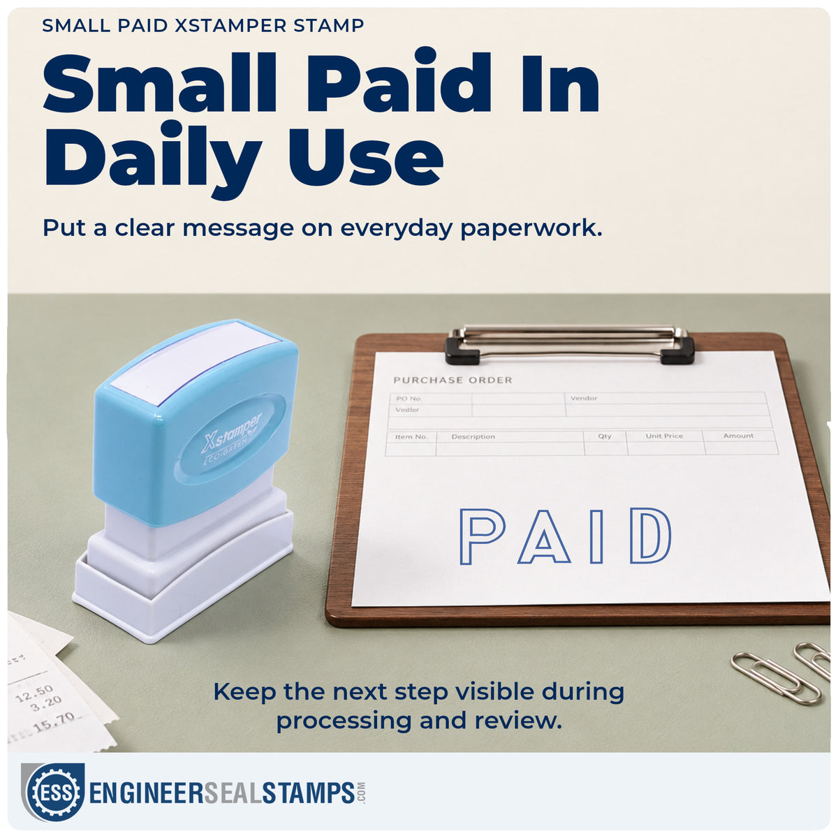 "Paid" stamp being pressed onto a document during everyday filing
