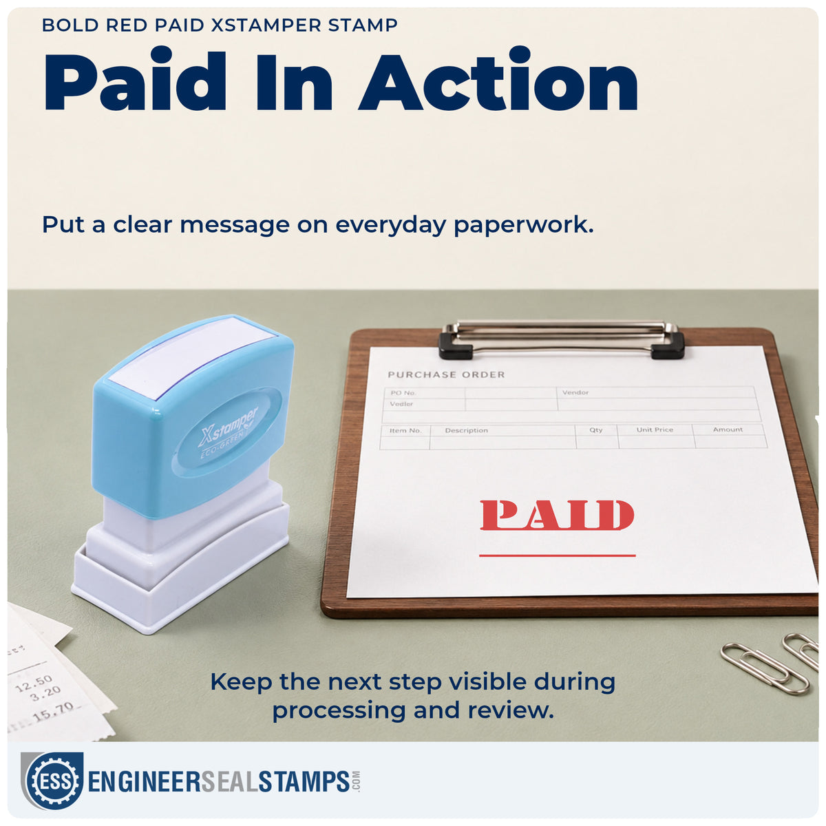 "Paid" stamp being pressed onto a document during everyday filing