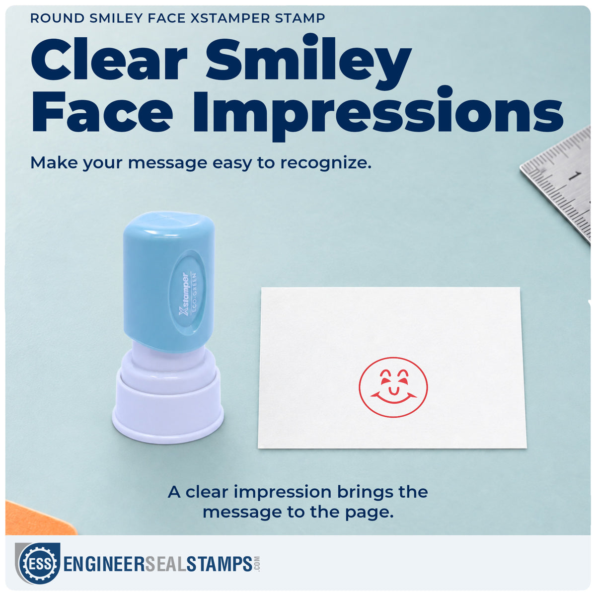 "Smiley face" imprint on office paperwork beside the Xstamper Smiley Face Stamp – Round Red Pre-Inked
