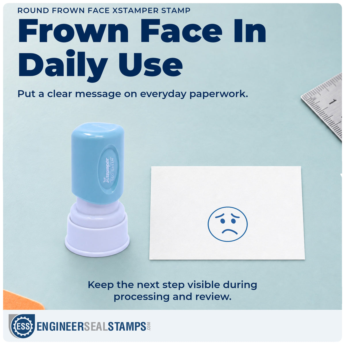 "Frown face" stamp being pressed onto a document during everyday filing